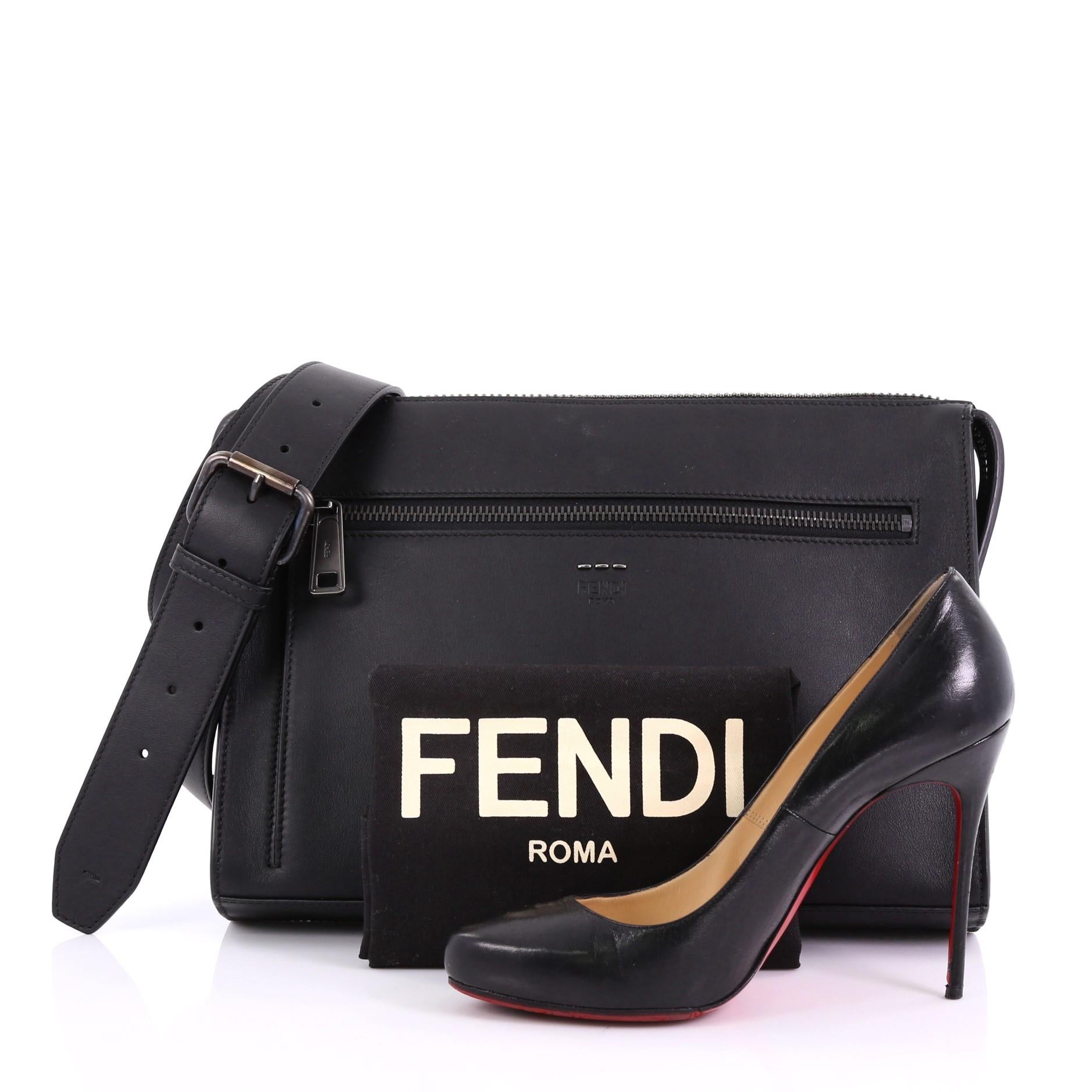 This Fendi Convertible Document Holder Leather Medium, crafted in black leather features an adjustable shoulder strap, exterior front pocket and gunmetal-tone hardware. Its zip closure opens to a black fabric interior with zip and slip pockets.