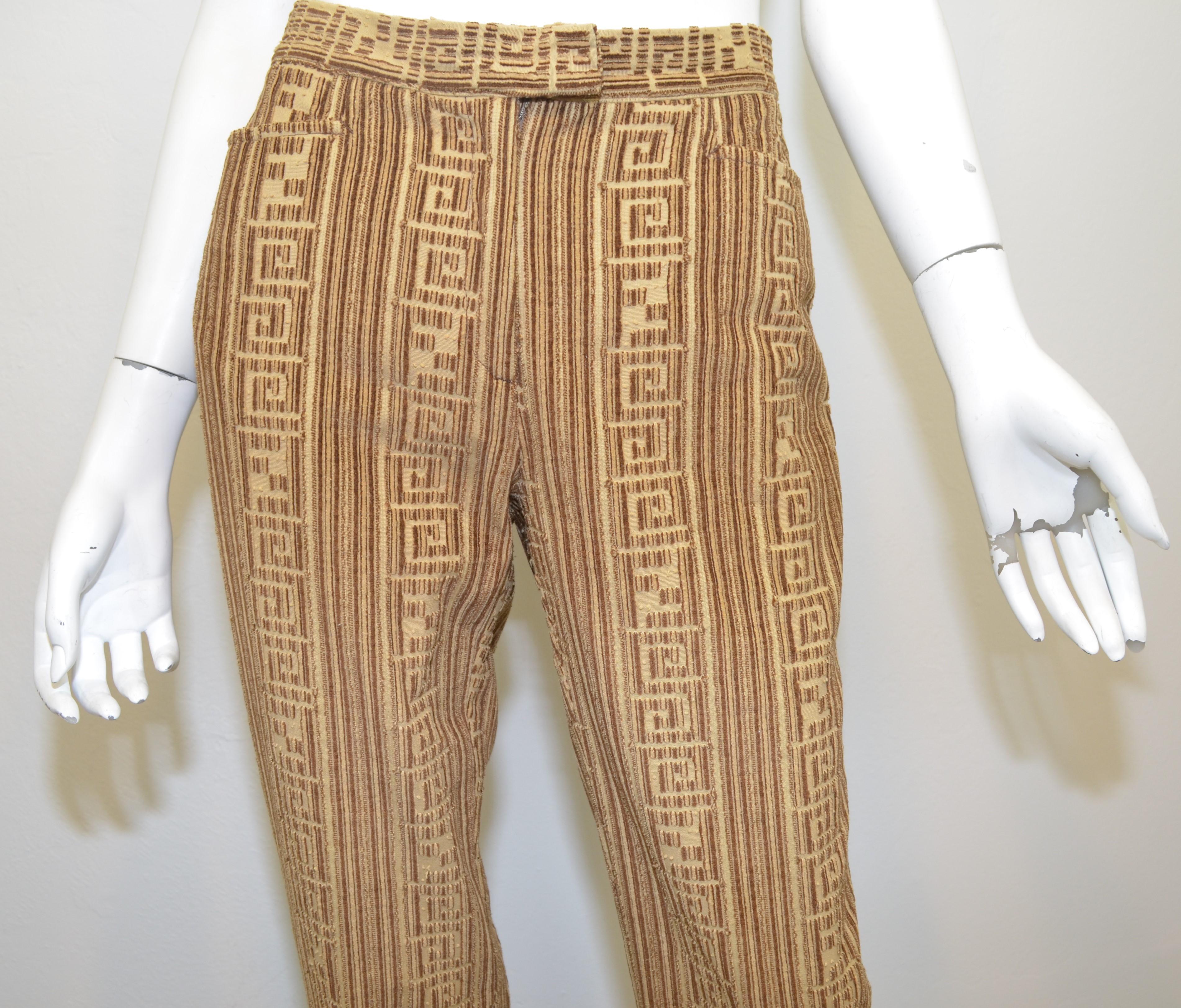 Fendi corduroy pants in tan and brown with a signature Zucca design, zipper and hook closure, functional pockets at the front and a slit back pocket. Pants are labeled size 42, made in Italy.

Measurements:
waist 28''
hips 37''
inseam 33'' 
rise