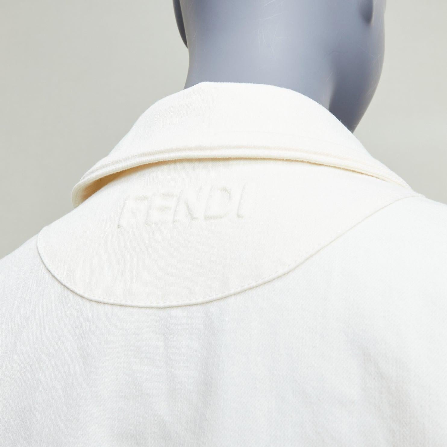 FENDI cream debossed trompe loeil pockets denim trucker jacket IT38 XS
Reference: KNLM/A00360
Brand: Fendi
Material: Cotton
Color: Cream
Pattern: Solid
Closure: Snap Buttons
Extra Details: FENDI debossed logo at back.
Made in: