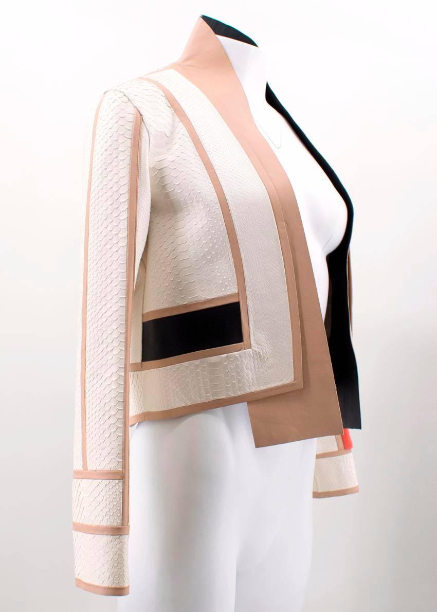 Fendi cream python jacket. 
Made in Italy. 

African rock python. 
Features mink fabric on cuff of left sleeve. 
Includes a collar and long sleeves. 

Fabric: African rock python/Mink/80% Polyamide, 20% Elastane. 

Size: XXS. 
Size IT 38, FR 34, UK