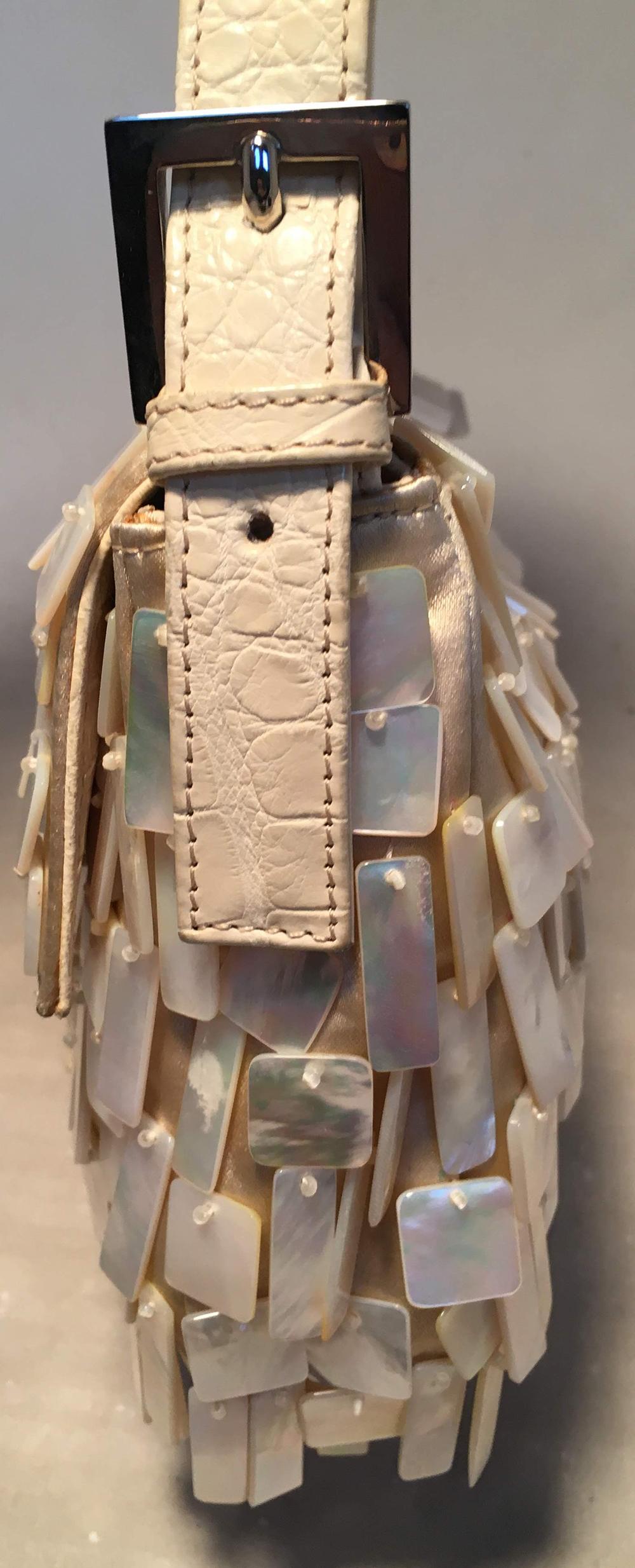 Fendi Cream Satin Mother of Pearl Shell Baguette in excellent condition. Cream satin body with natural cream mother of pearl square and rectangle beads attached throughout exterior. Cream alligator adjustable shoulder strap and front strap logo