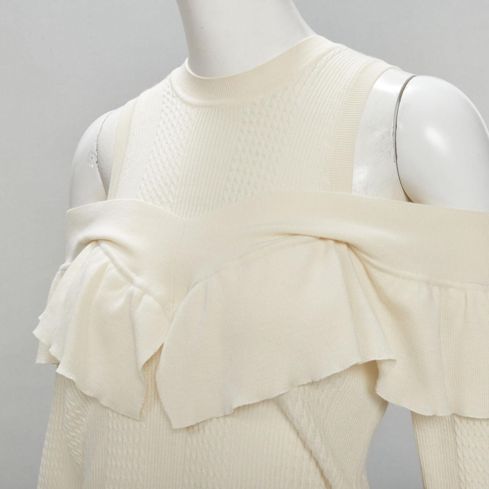 FENDI cream wool silk cashmere cold shoulder ruffle knit sweater IT44 M
Reference: KNLM/A00084
Brand: Fendi
Material: Wool, Blend
Color: Beige
Pattern: Solid
Extra Details: Faux layered cold shoulder design.
Made in: Italy

CONDITION:
Condition: