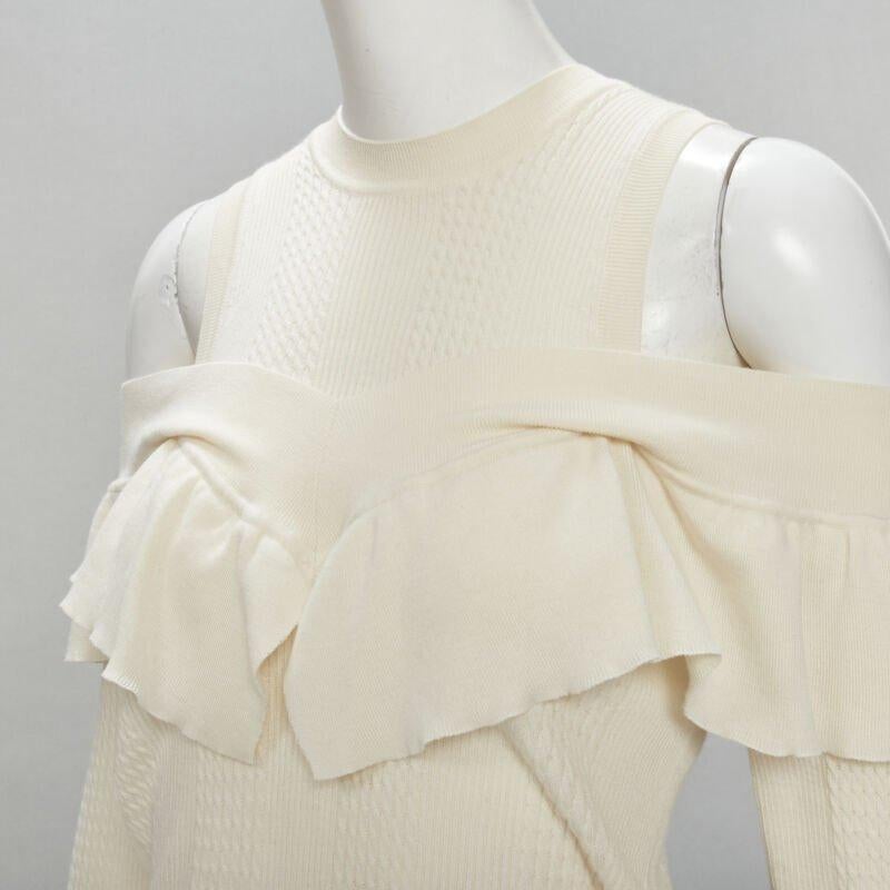 FENDI cream wool silk cashmere cold shoulder ruffle knit sweater IT44 M
Reference: KNLM/A00084
Brand: Fendi
Material: Wool, Blend
Color: Beige
Pattern: Solid
Extra Details: Faux layered cold shoulder design.
Made in: Italy

CONDITION:
Condition: