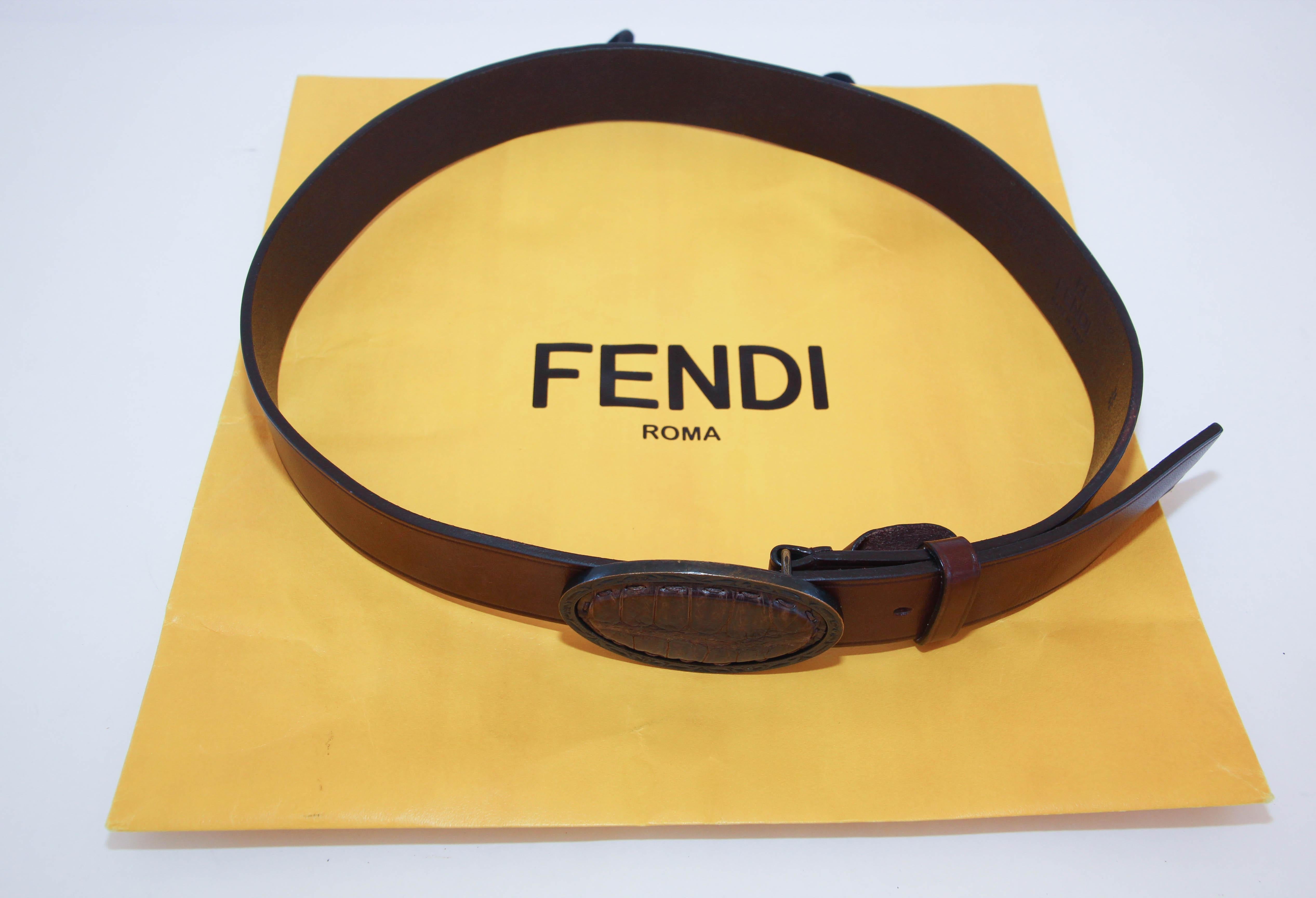 FENDI Crocodile Moca Brown leather Cowboy Belt.
Belt in genuine leather made in Italy with an oval shape belt  antiqued brass buckle with crocodile leather inset in center.
 Dress up or dress down, this leather belt can be worn for any occasion.