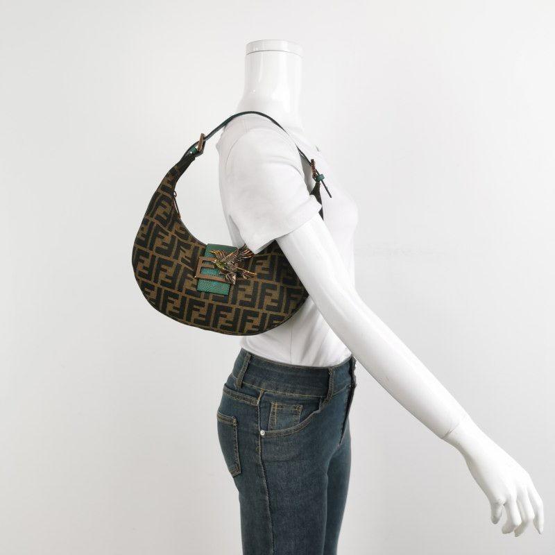 Fendi Croissant Shoulder Bag Medium Zucca Monogram Canvas Lizard-skin Strap Bird Brooch
These are professional photos of the actual bag.
  CONDITION: VERY GOOD
  Light signs of use.
  DETAILS
  
  Fendi 
  Croissant
  Zucca monogram canvas
  Lizard