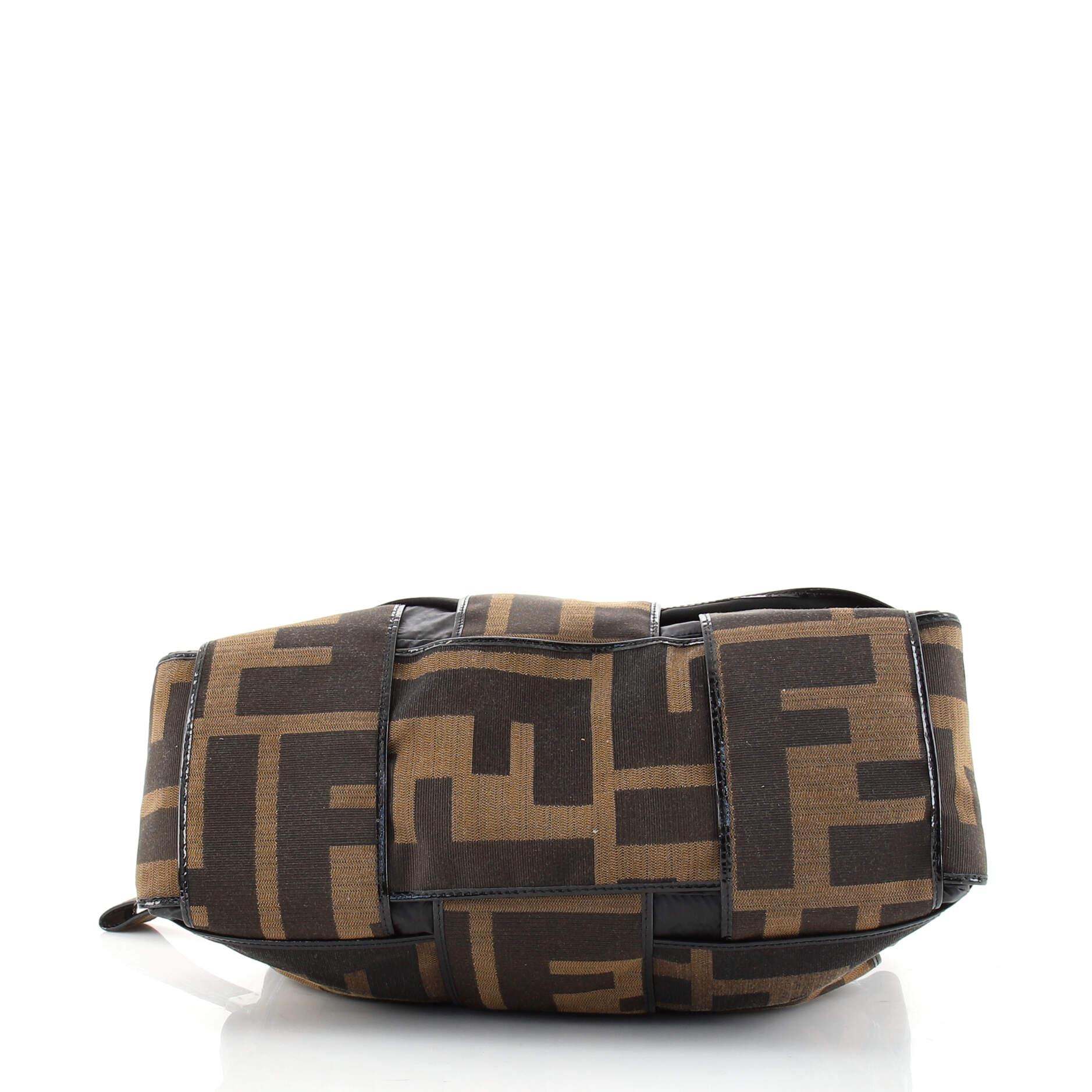 large shoulder purse crossword