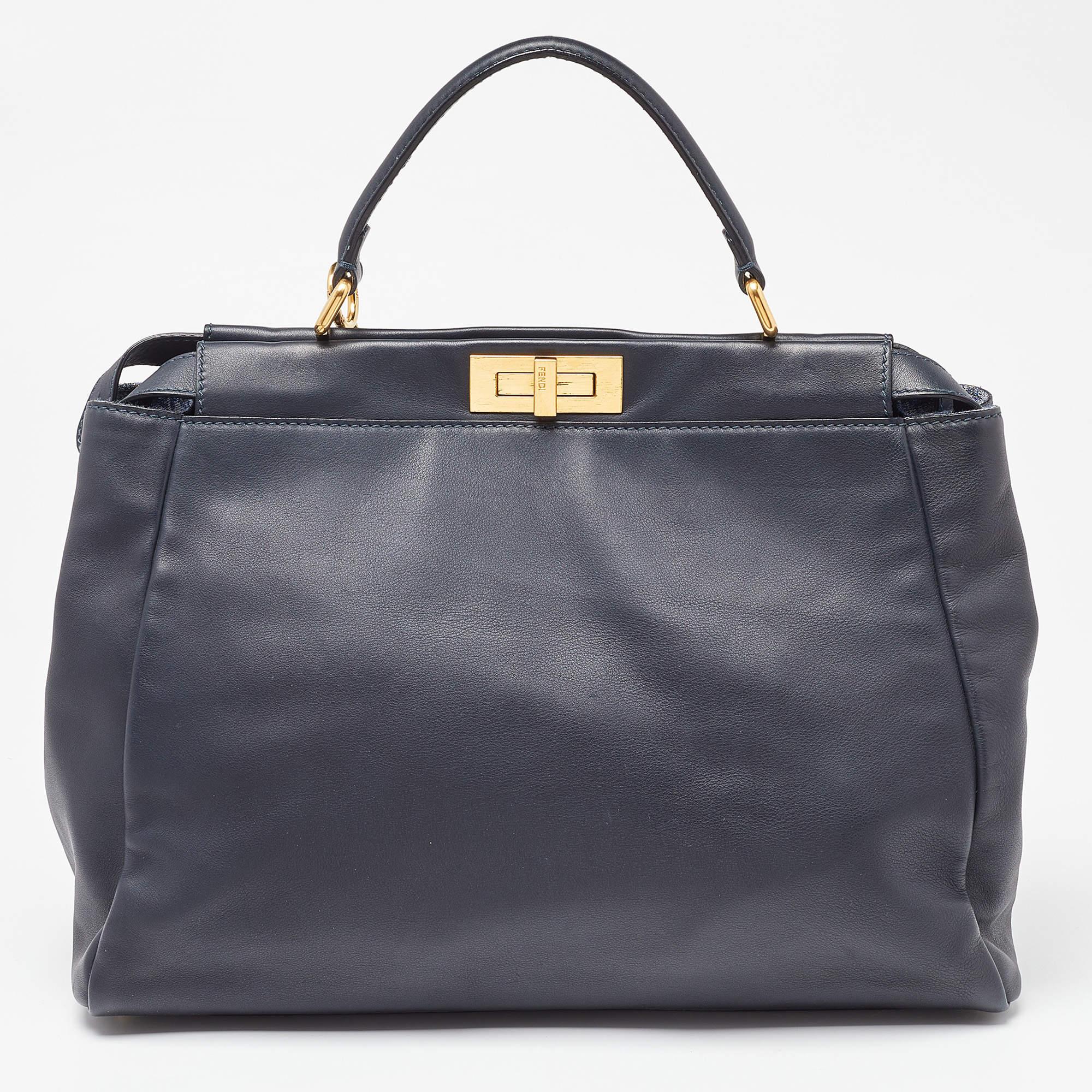 Exuding unparalleled elegance and sophistication, this bag is made from the finest material in a gorgeous hue. While the roomy interior offers ample space, the top handle allows you to carry it with much elegance.

Includes: Detachable Strap, Info