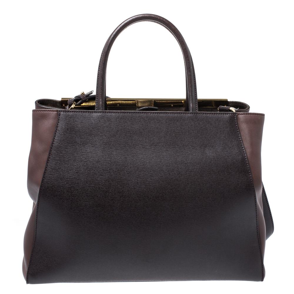 Fendi's 2Jours tote is one of the most iconic designs from the label and it still continues to receive the love of women around the world. Crafted from dark brown leather, the bag features double rolled handles. It is also equipped with a fabric