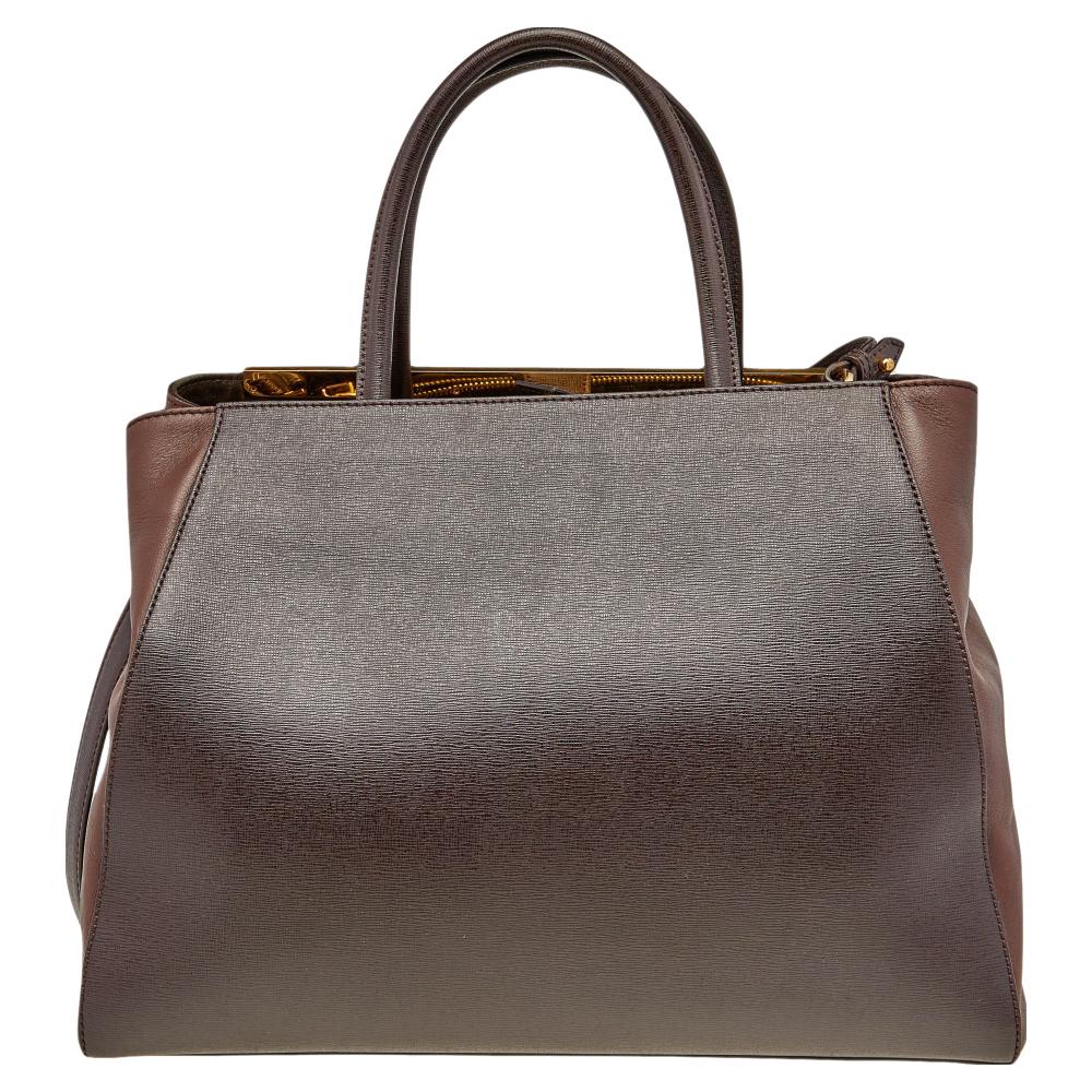 Fendi's 2Jours tote is one of the most iconic designs from the label and it still continues to receive the love of women around the world. Crafted from dark brown leather, the bag features double handles and an optional strap. It is equipped with a