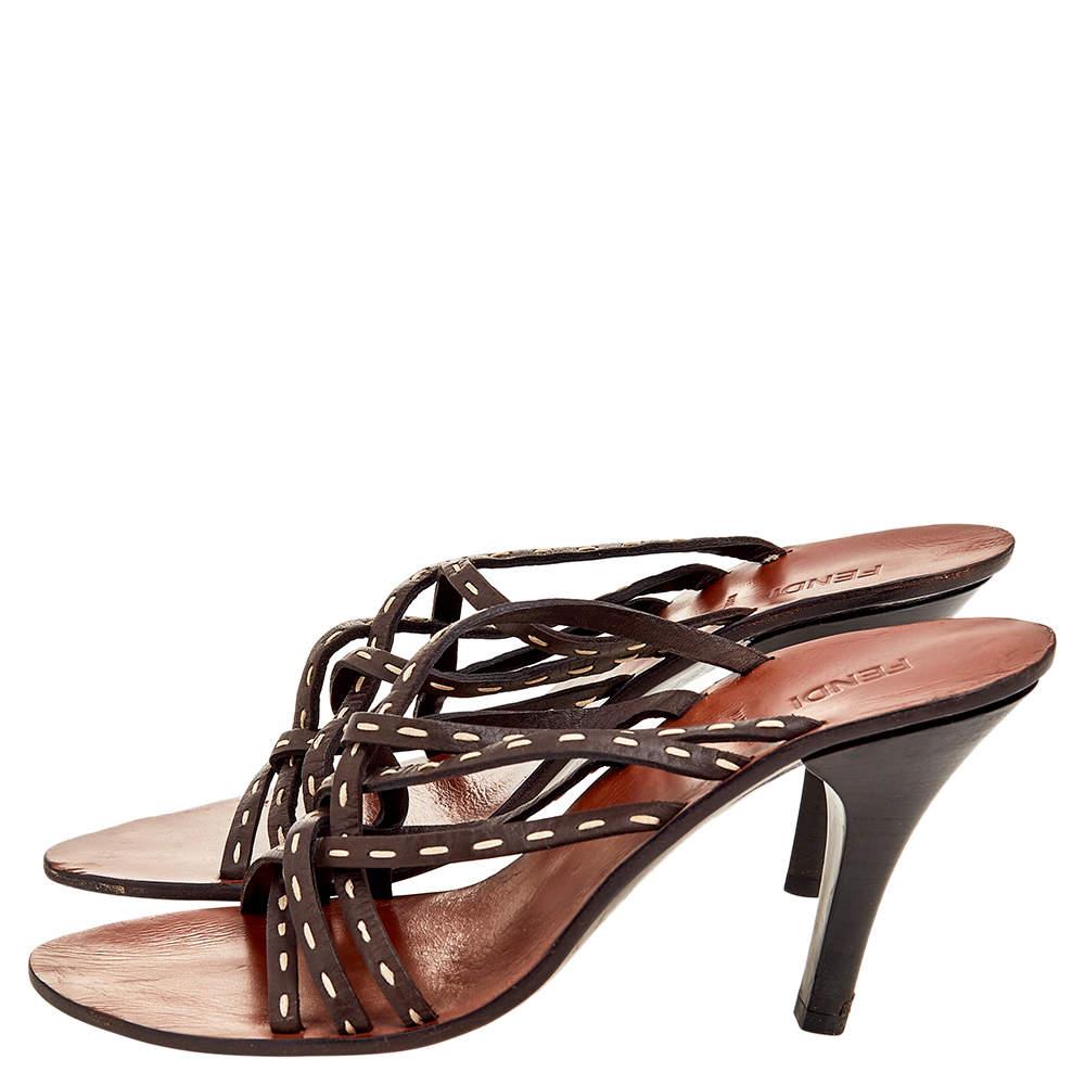 Wear these sandals from Fendi and look gorgeous. They are made from dark-brown leather and showcase strappy accents on the upper and a slip-on style. These sandals are completed with 10 cm heels. Look nothing but chic as you style these beauties.

