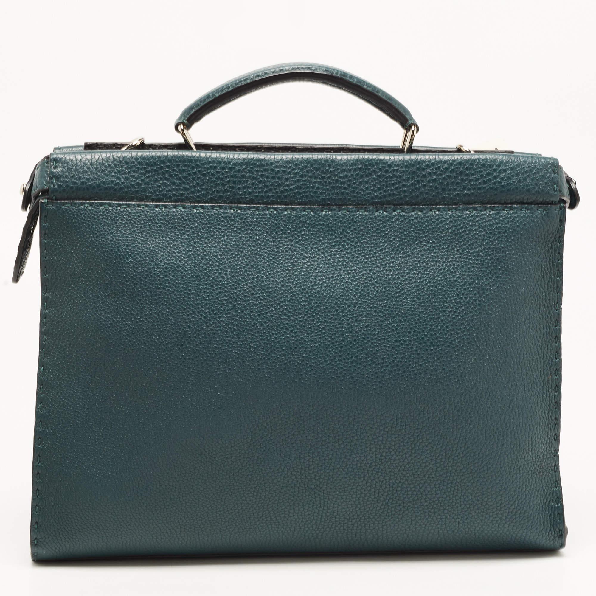 Perfect for housing your documents and other work essentials, this briefcase will make an elegant choice. Crafted with function in mind, this bag features a central capacious interior.

Includes: Original Dustbag, Detachable Strap, Rain Cover, Info