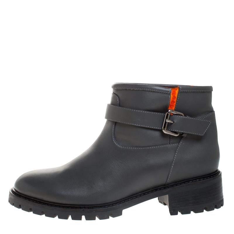 Give your look a stylish Fendi finish with these grey-hued ankle boots. These leather-made boots are accented with a buckled strap around the ankles, round toes and soft fur lining on the inside. These shoes are complete with sturdy rubber