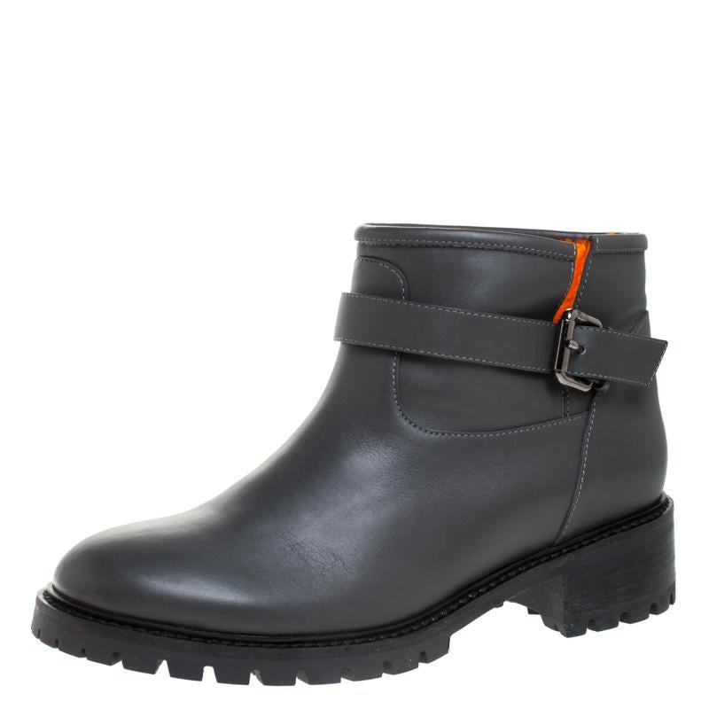Give your look a stylish Fendi finish with these grey-hued ankle boots. These leather-made boots are accented with a buckled strap around the ankles, round toes and soft fur lining on the inside. These shoes are complete with sturdy rubber