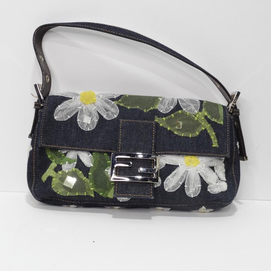 There are just so many beautiful things to look at on this gorgeous denim Fendi Baguette! From the ever so elegant flower embroidery contrasting the dark-wash denim to the silver hardware and leather strap, this handbag is truly one of a kind.