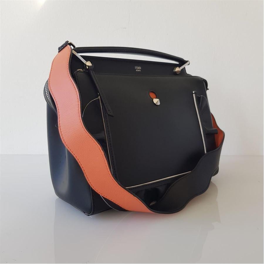 Leather Black color Salmon inserts Can be carried by hand or on shoulder Double zip closure Frontal embsossing Removable pochette in salmon leather Metal studs Suede internal Two internal pockets Cm 33 x 23 x 12 (12.9 x 9 x 4.72 inches) Original
