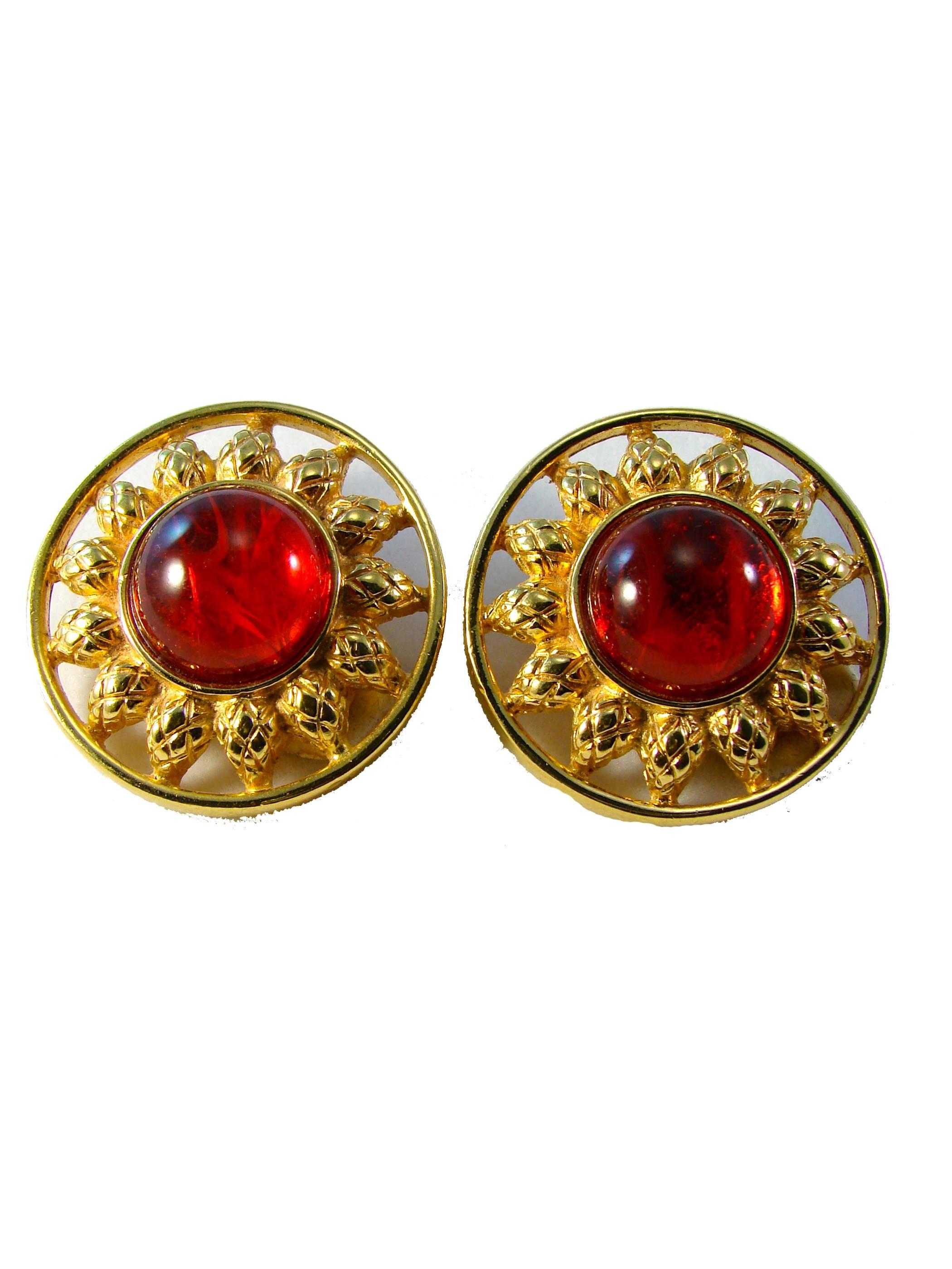 Incredible vintage earrings from Fendi feature a figural gold metal sun setting with large red glass cabochon center.  Clip Style.  Preowned with minimal signs of wear.  Earrings measure appx 1.5