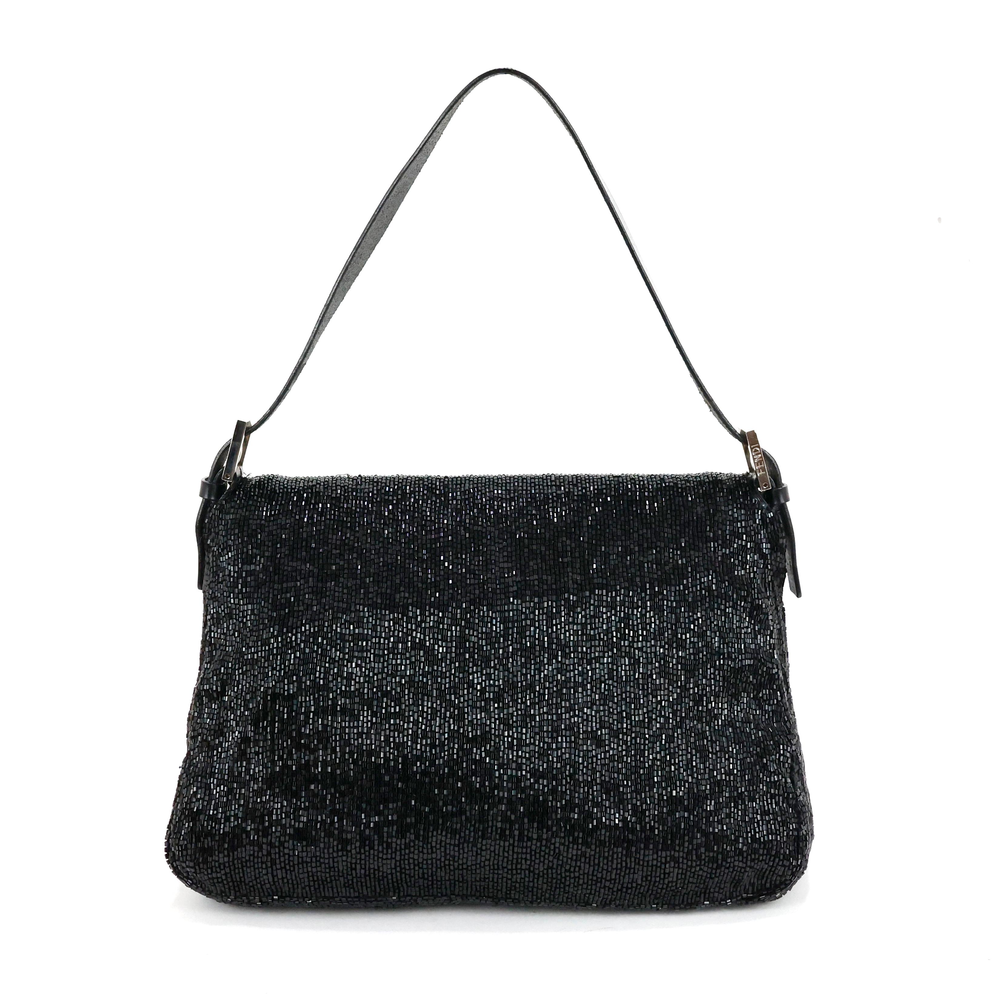 Fendi baguette, Mamma size, all over embroidered with micro stones + leather, black color, silver hardware.

Condition:
Really good.
 
Packaging/Accessories:
Dustbag.

Dimensions:
Width: 25cm
Height: 17cm
Depth: 7cm