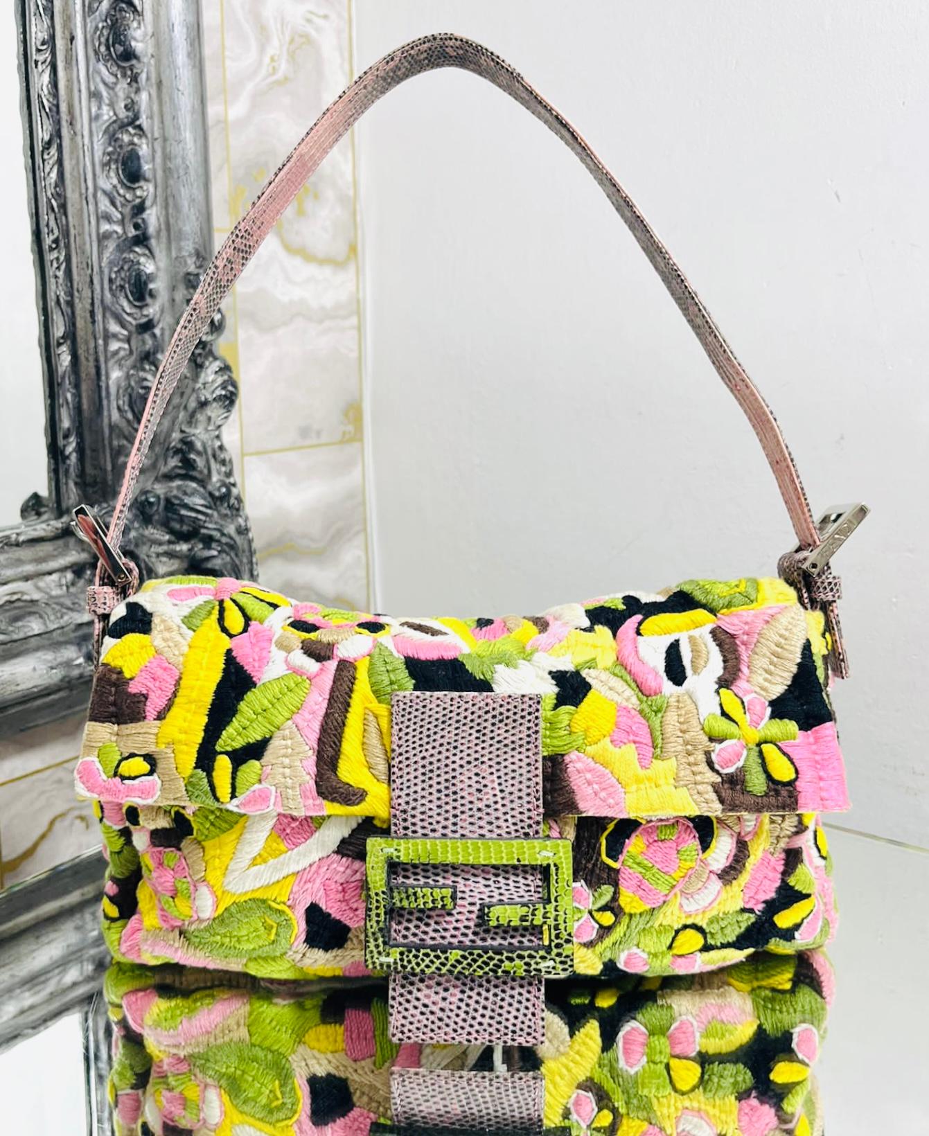 Fendi Embroidered Canvas & Lizard Baguette Bag

Multicoloured shoulder bag designed with abstract/floral embroidery throughout.

Detailed with lizard leather 'FF' logo snap closure and adjustable shoulder strap.

Featuring silver 'Fendi' engraved