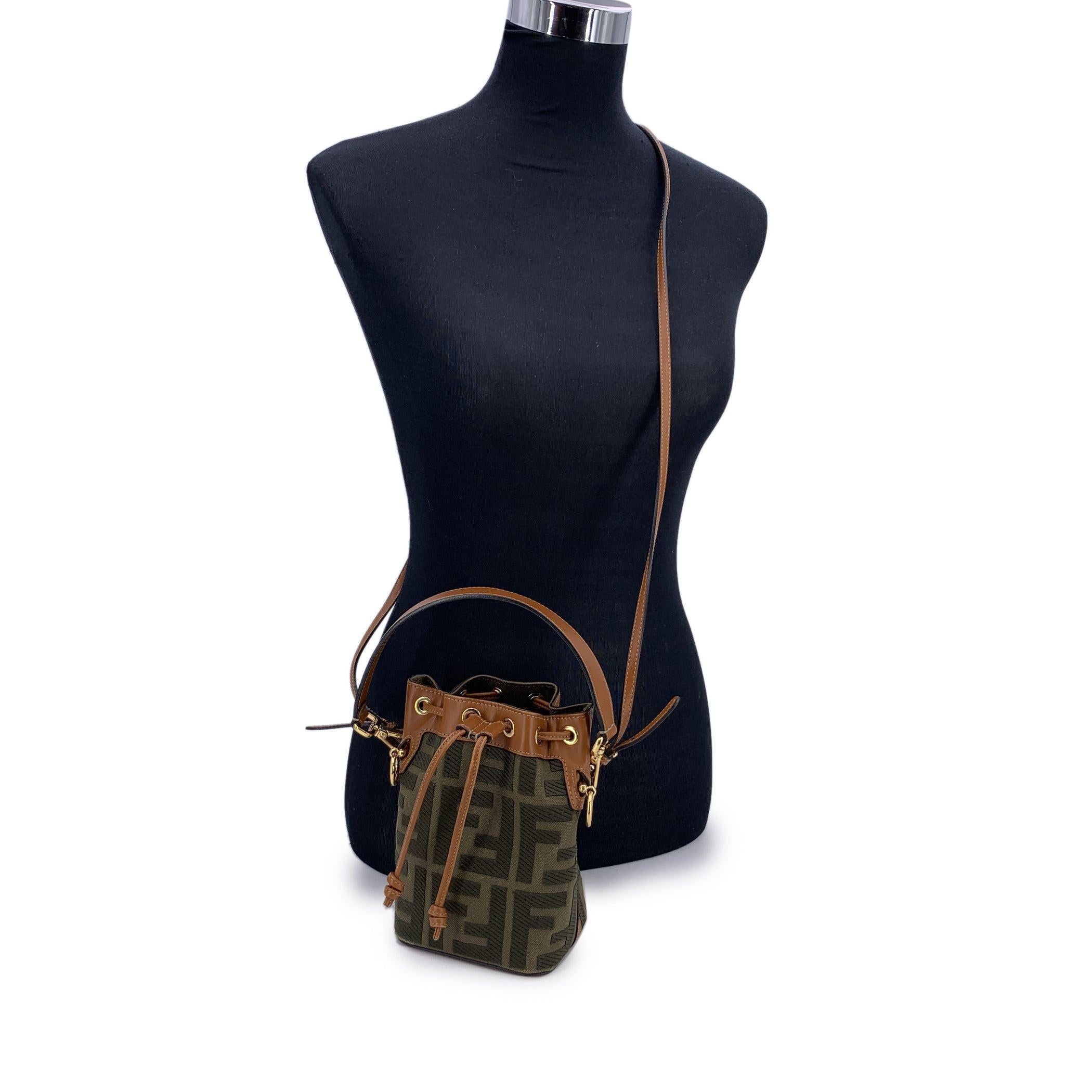 This beautiful item will come with a Certificate of Authenticity provided by Entrupy. The certificate will be provided at no further cost A petite powerhouse with bold personality, the Fendi Mon Tresor Mini Bucket Bag is a modern classic with deep