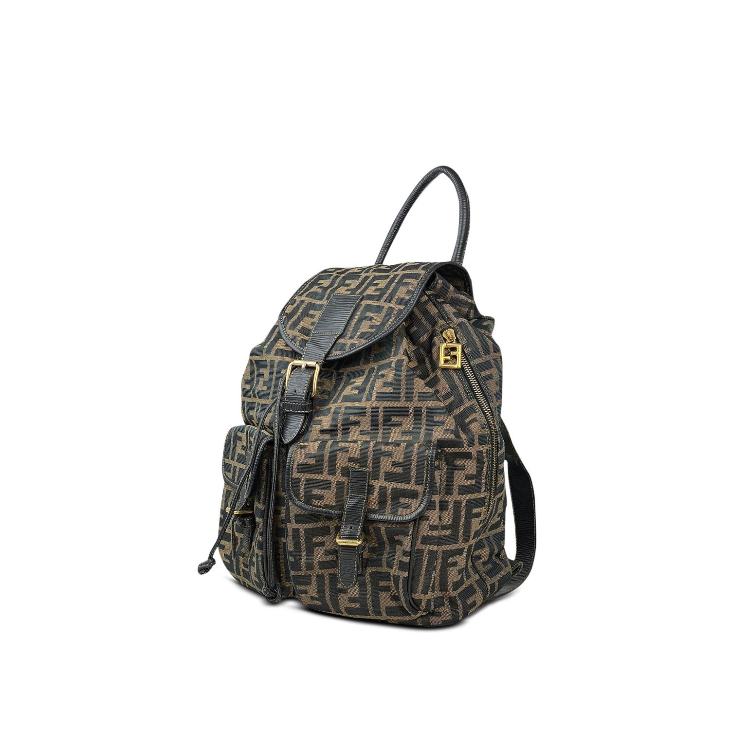 Brown and tan canvas Fendi FF backpack with

- Gold-tone hardware
- Dual flat shoulder strap
- Brown leather trim
- Brown interior lining with a zip pocket at interior wall and drawstring closure at top 
- Dual exterior pockets and a zip opening on