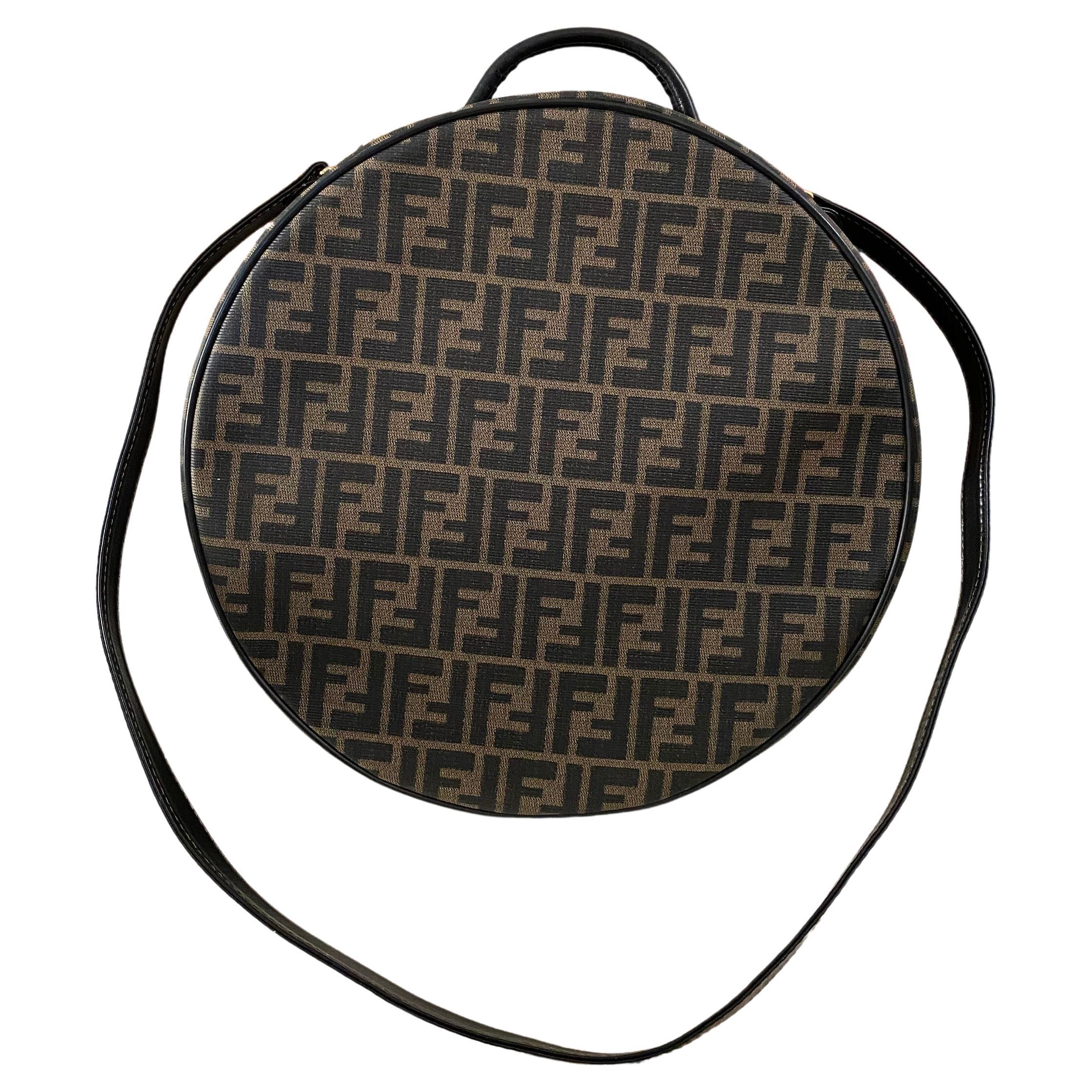 Fendi FF Circle Round Vintage Rare 90's Top Handle Shoulder Bag 

Monogram canvas
Leather trim
Gold tone hardware
Measures 13