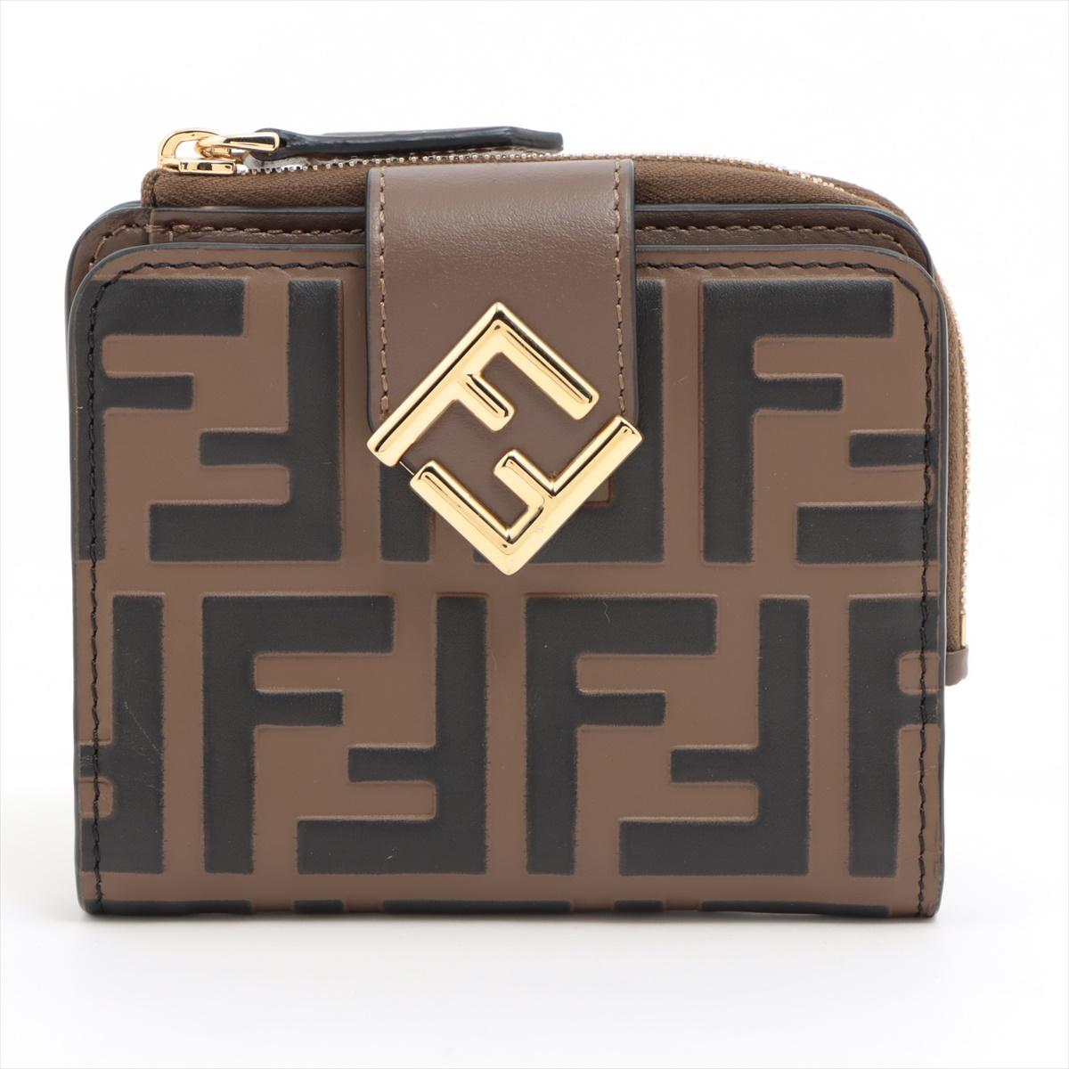 The Fendi FF Interlocking Logo Leather Wallet in Brown is a sophisticated accessory that exudes luxury and style. Crafted from high-quality leather, the wallet features Fendi's iconic FF interlocking logo pattern embossed on the exterior, showcasing
