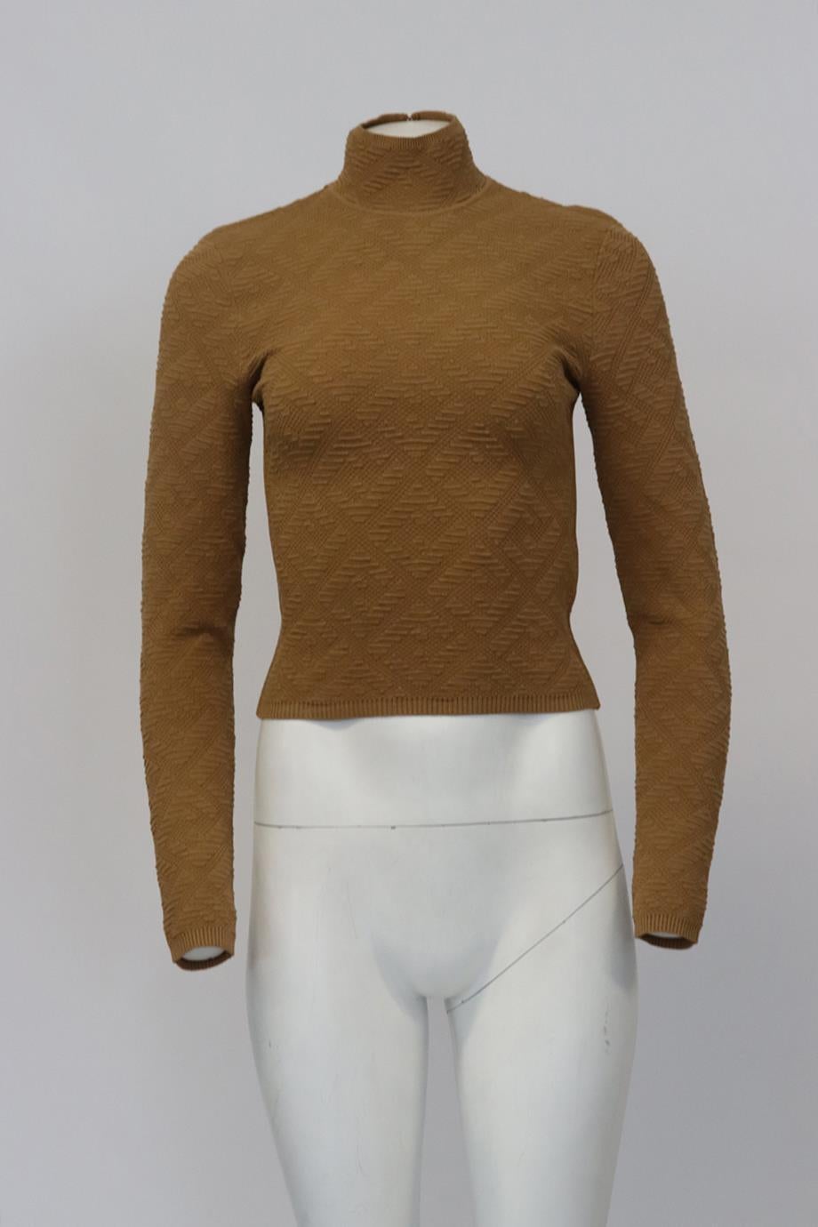 Fendi Ff Jacquard Stretch Knit Turtleneck Sweater. Tan. Long Sleeve. Turtleneck. Slips on. 67% Viscose, 33 polyester. IT 38 (UK 6, US 2, FR 34). Bust: 29.1 in. Waist: 27 in. Hips: 24.5 in. Length: 21.4 in. Condition: New with tags.
