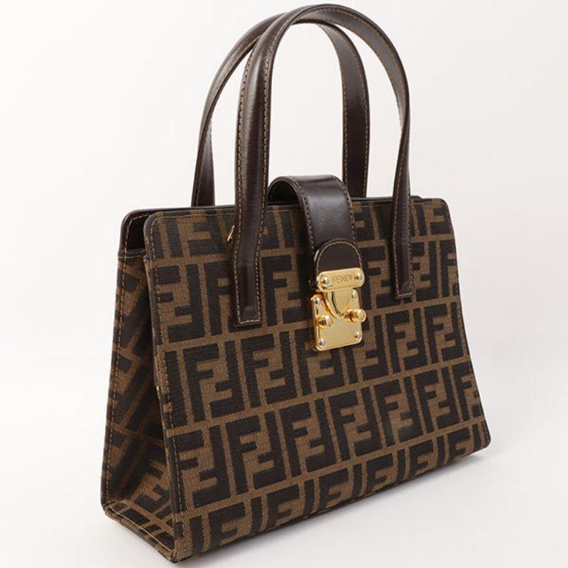 Fendi Ff Pattern Logo Plate Metal Clasp 2Way Bag Brown

Additional information:
Interior pocket x3
Made in Italy
Measurements: 27 W x 8 D x 18 H cm
Shoulder drop: 109 cm 
Handle: 38 cm
Condition: Good
Front: No obvious damage
Back: No obvious