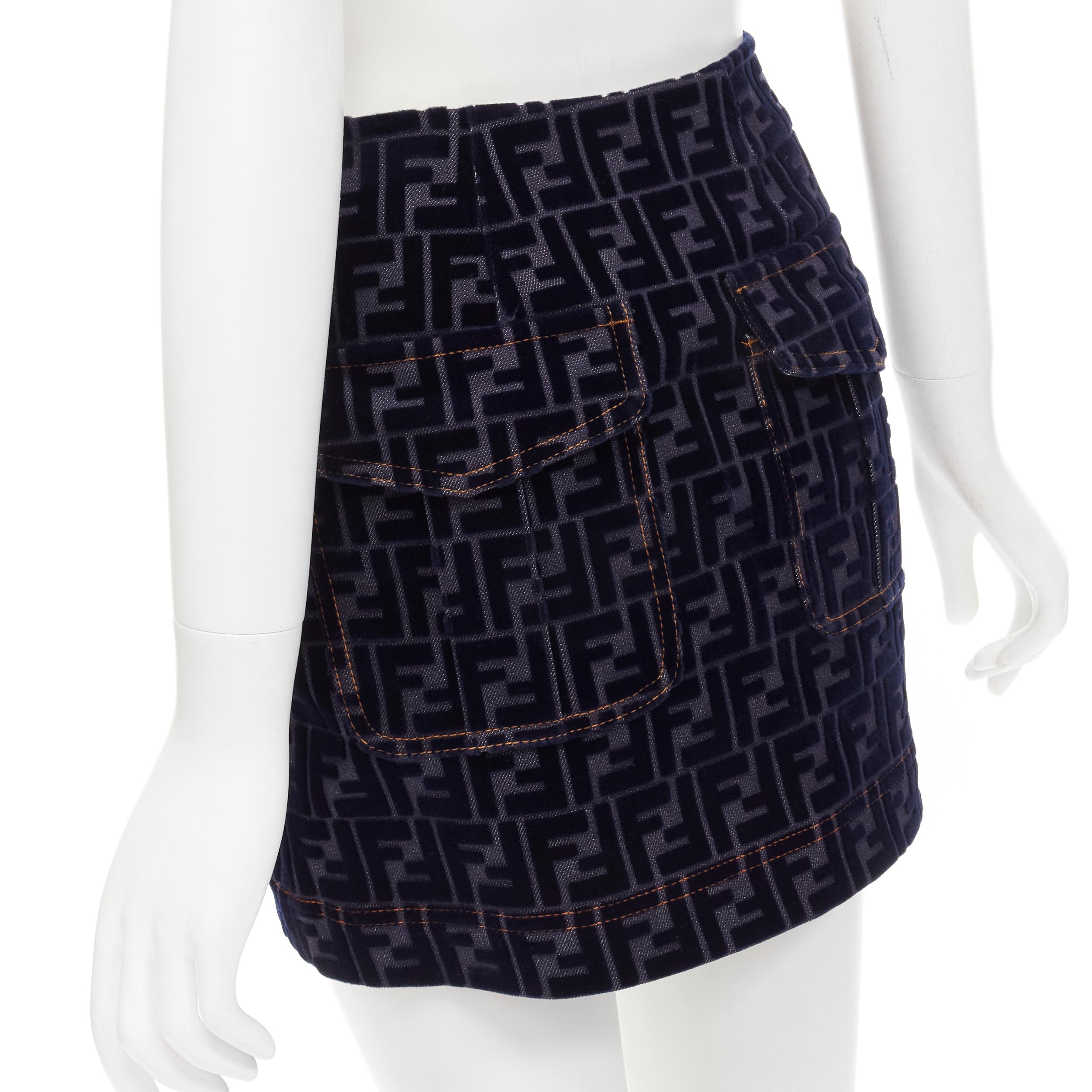 FENDI FF Zucca monogram velvet flocking mini denim skirt S 
Reference: ANWU/A00434 
Brand: Fendi 
Material: Feels like denim 
Color: Blue
Pattern: Monogram 
Closure: Zip 
Extra Detail: Orange overstitching. Side zip closure with Fendi metal zip