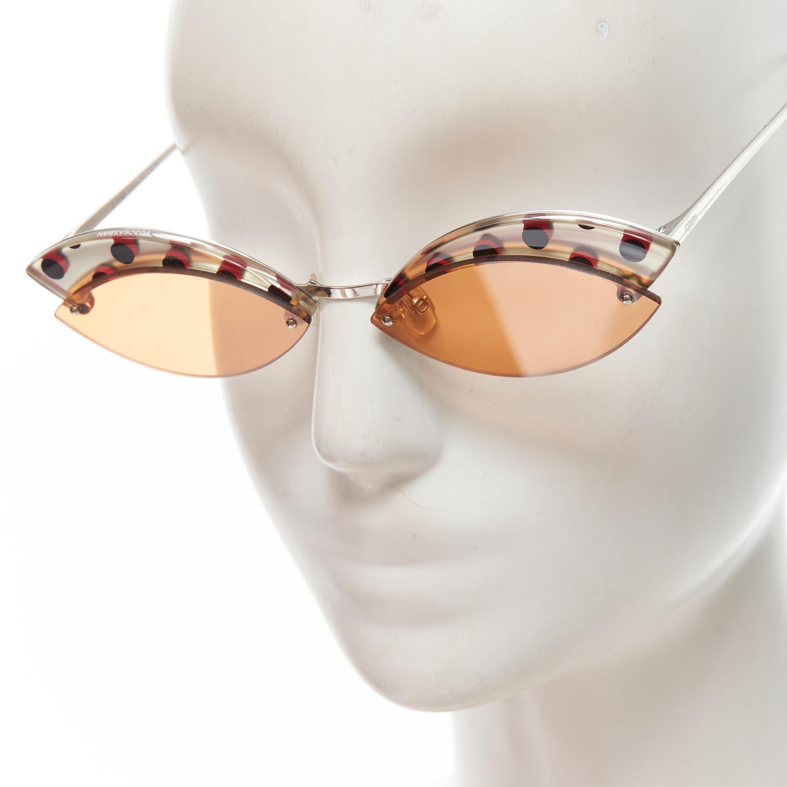 FENDI FF0370 1990's polka dot orange tint rimless butterfly sunglasses 
Reference: ANWU/A00067 
Brand: Fendi 
Material: Acetate 
Color: Orange 
Pattern: Polka dot 
Made in: Italy 


CONDITION: 
Condition: Excellent, this item was pre-owned and is in