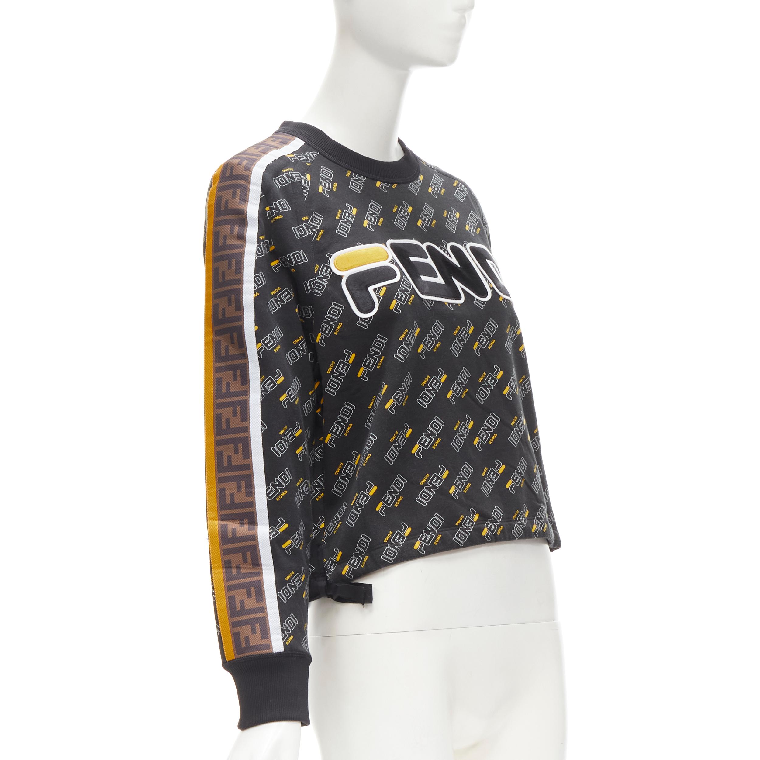 FENDI FILA Mania graphic logo embroidery monogram FF Zucca pullover sweater S
Brand: Fendi
Material: Feels like cotton
Color: Black
Pattern: Monogram
Closure: Pullover
Extra Detail: FF Zucca trim along sleeves. Grosgrain ribbon drawstring at side