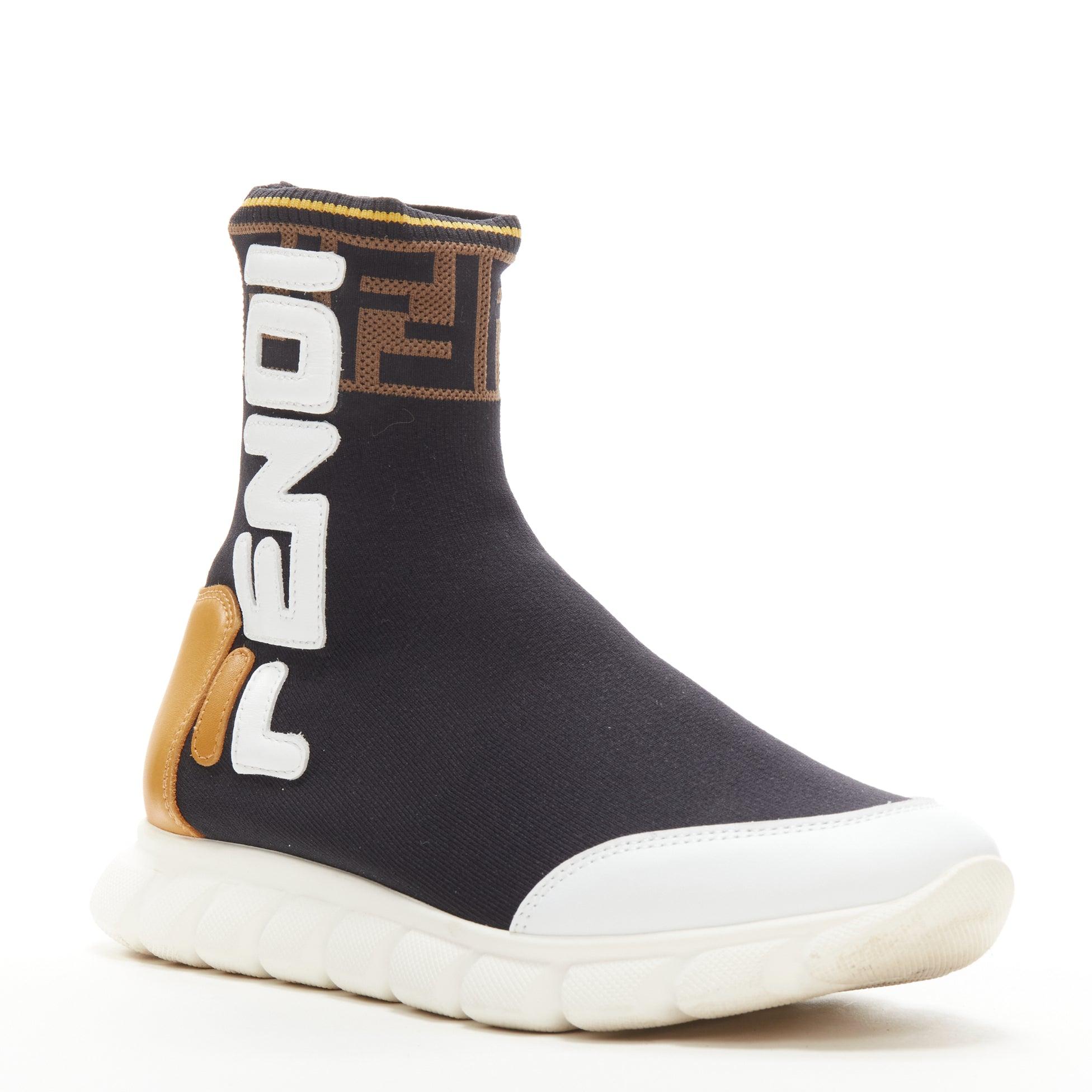 FENDI FILA Mania white logo lettering Zucca FF sock knit high top sneaker EU36
Reference: ANWU/A00387
Brand: Fendi
Material: Fabric
Color: Black, Brown
Pattern: Solid
Extra Details: Stretch fit. FENDI logo patchwork on side. FF Zucca trim along