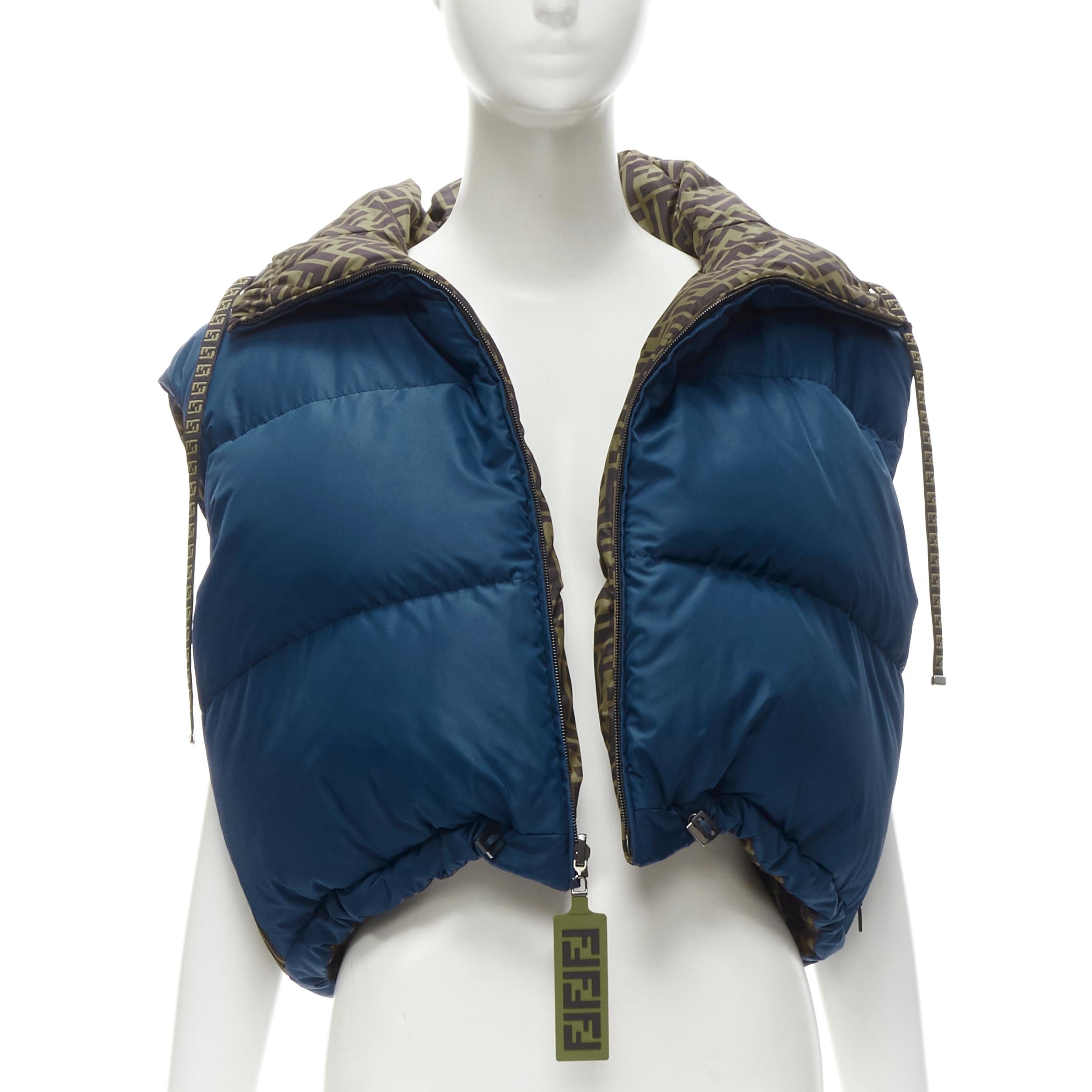 FENDI FILA Reversible FF Zucca monogram blue down puffer cropped vest S 
Reference: ANWU/A00761 
Brand: Fendi 
Collection: Fila Collection 
Material: Nylon 
Color: Blue 
Pattern: Solid 
Closure: Zip 
Extra Detail: Fully reversible with navy blue and