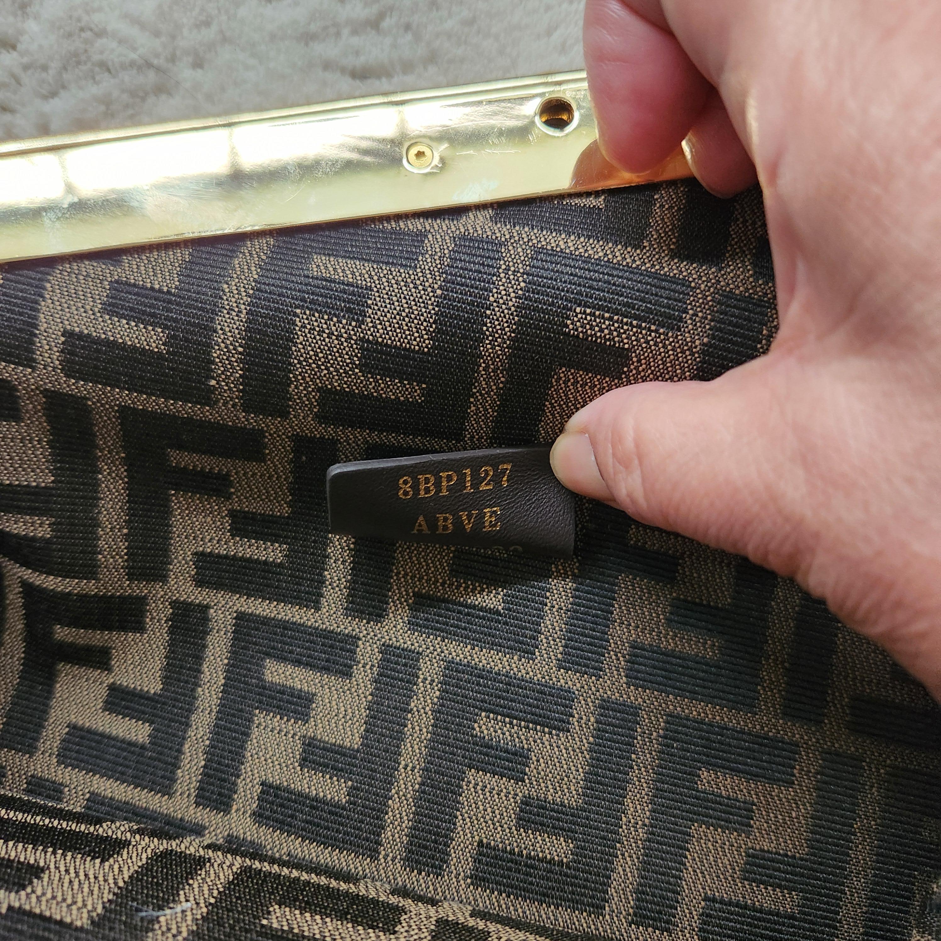 Fendi First Medium Bag – Brown with Gold Hardware

Sophisticated and sculptural, the Fendi First Medium Bag is a standout piece in modern luxury. Crafted from rich brown nappa leather, the design is defined by its bold, oversized F-shaped clasp in