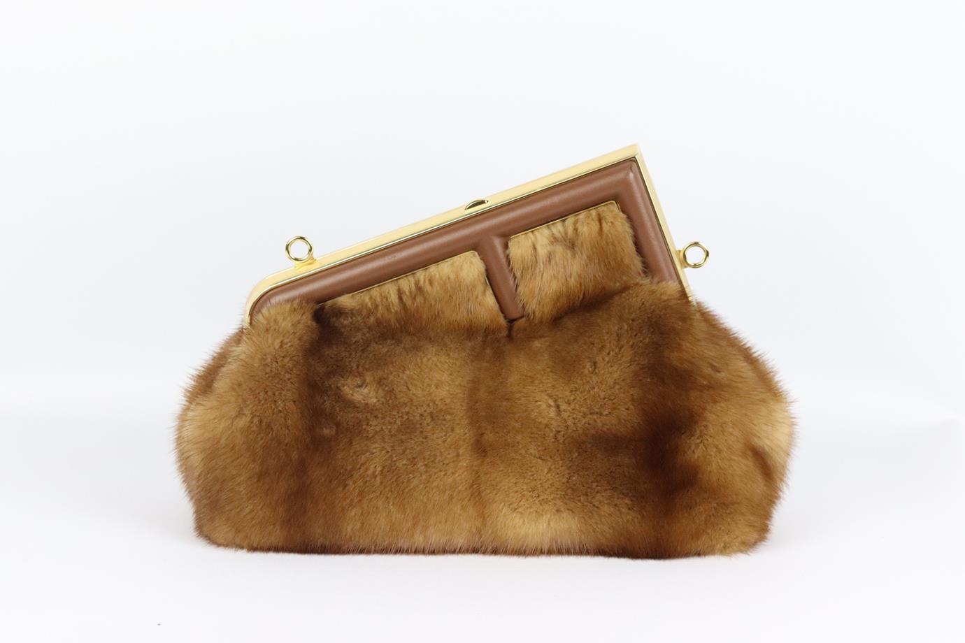 Fendi First small leather trimmed mink fur shoulder bag. Brown. Push lock fastening at top. Comes with dustbag. Protective plastic attached. Height: 7.9 in. Width: 10 in. Depth: 4.5 in. Strap Drop: 18.5 in. Light scuffing along the leather from poor