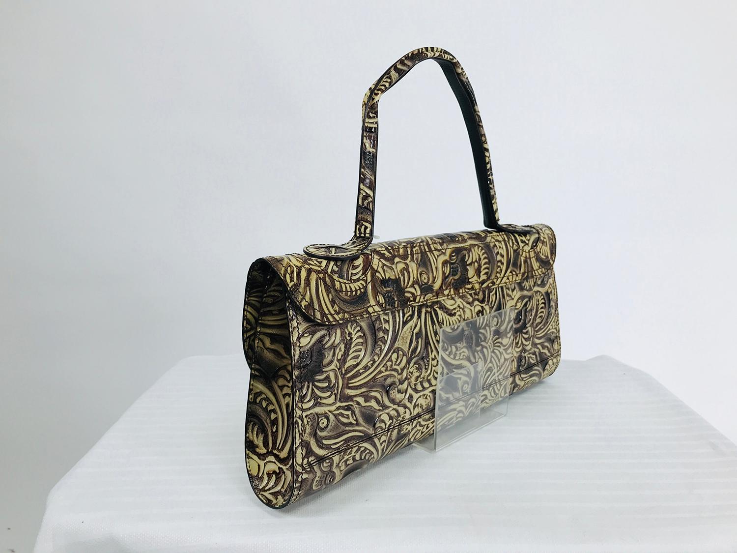Fendi flap front, wide brown & cream tooled leather shoulder bag or clutch with tags. Rectangular bag has a flap front with hidden magnetic closure, top handle can be carried on the shoulder. The bags tooled design ads a three dimensional look &