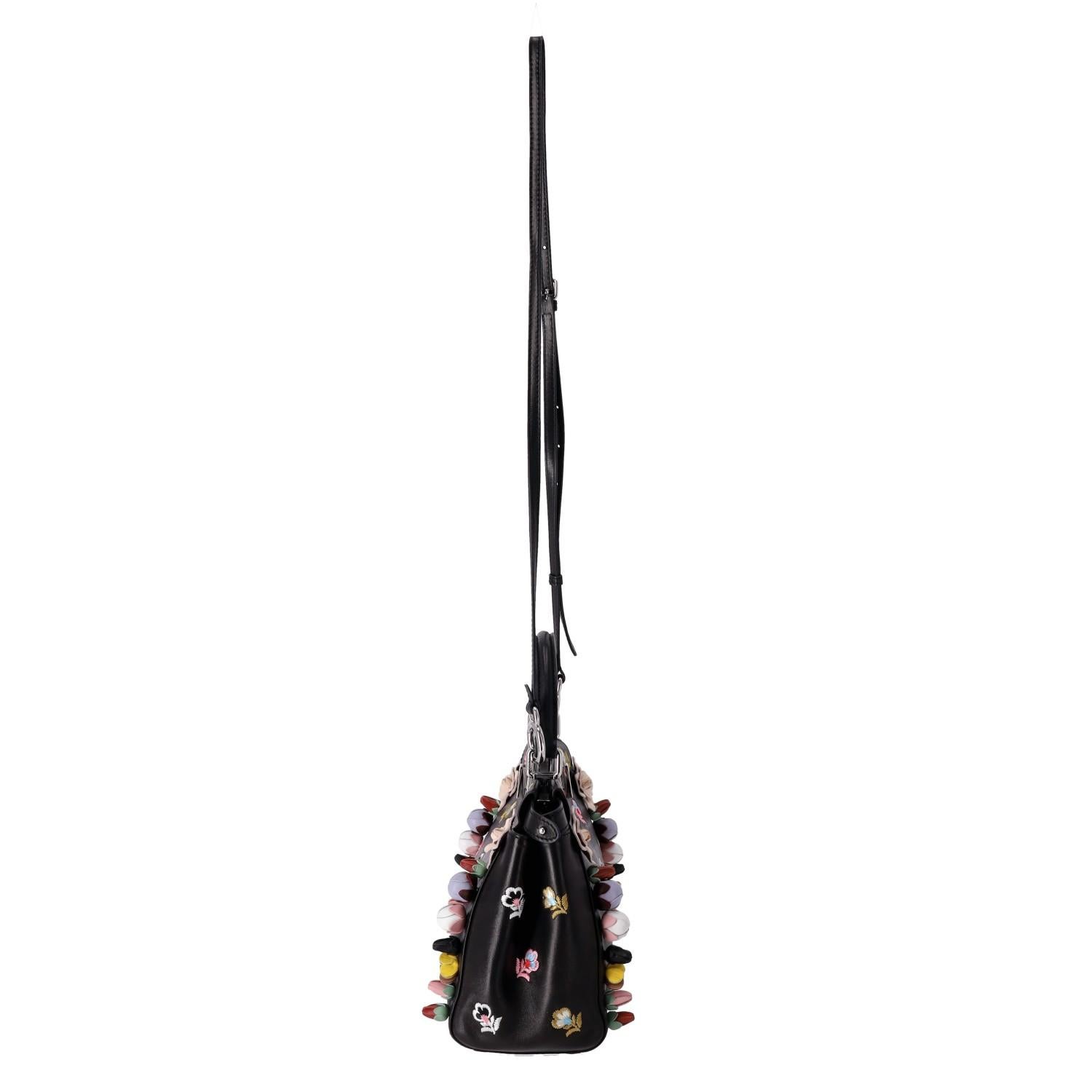 Fendi Floral Embellished Peekaboo Leather Crossbody Bag

Black handbag embellished with multicolour floral leather appliques and embroideries.

Detailed with silver branded hardware and twist lock closure.

Featuring top handle and adjustable,