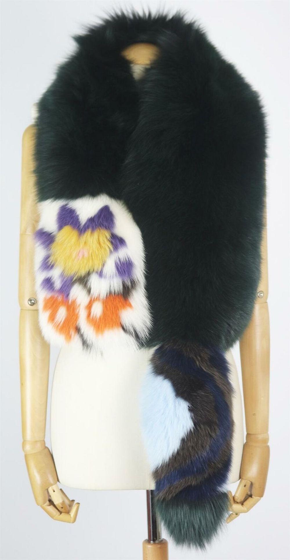 This lush, lustrous fox-fur and silk scarf by Fendi in a colour-block design featuring a floral pattern, combined with ivory silk, it envelopes the wearer in pure luxury.
Multicoloured fox-fur, ivory silk..
Concealed hook fastening at front.
100%