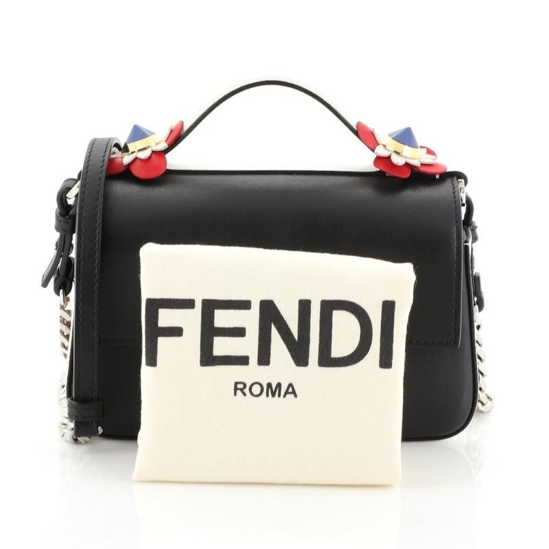 This Fendi Flowerland Double Baguette Crossbody Bag Leather Micro, crafted from black and neutral leather, features flat top leather handle with crystal floral embellishments, chain-link and leather shoulder strap, signature FF logo, and silver-tone