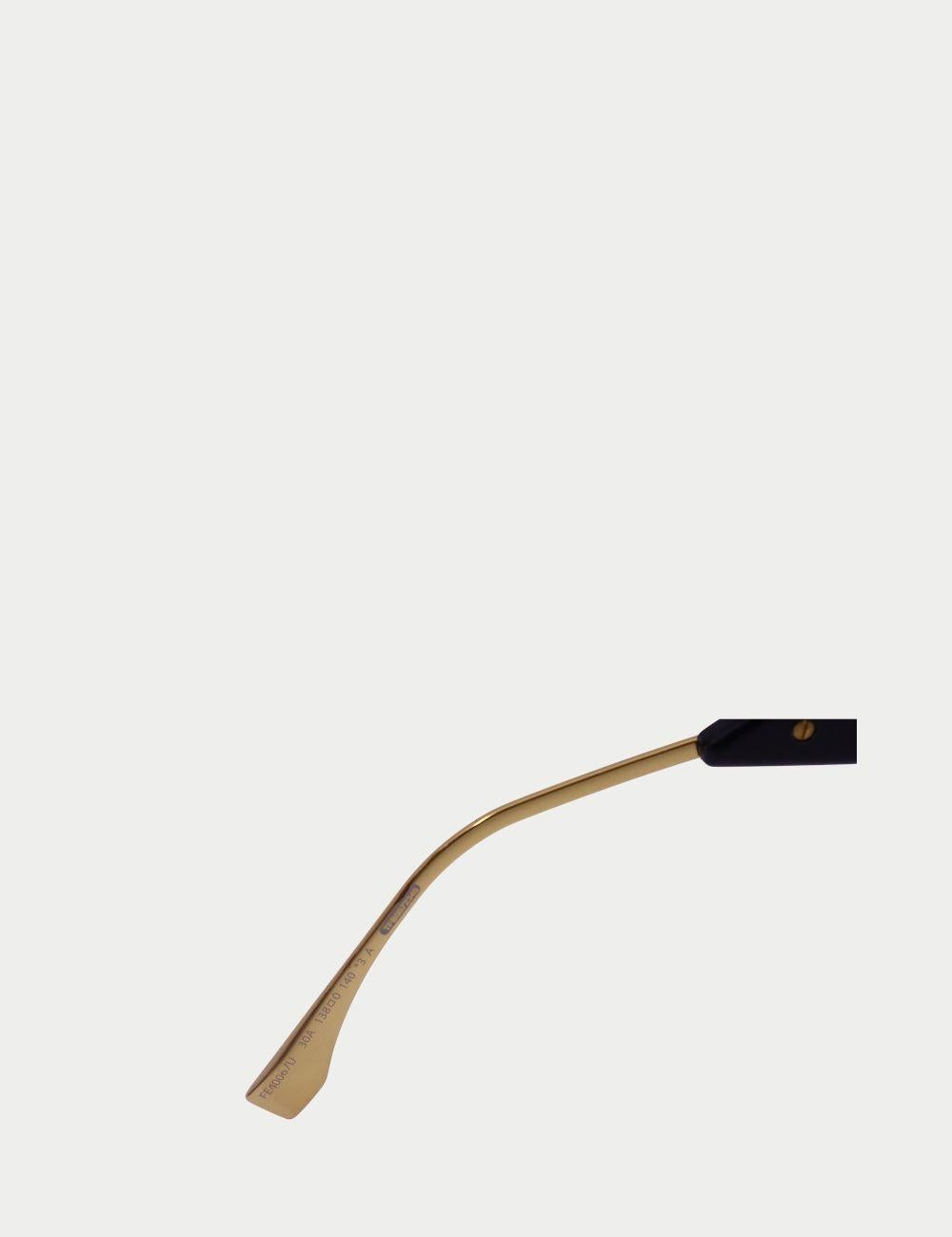 Fendi Black & Gold Shield Sunglasses – Women’s Designer Eyewear


Make a bold style statement with these Fendi black and gold shield sunglasses, a perfect fusion of contemporary edge and luxury craftsmanship. Featuring an oversized visor-style lens