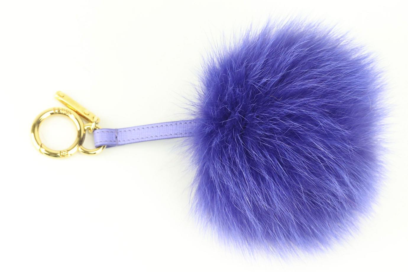 Fendi two tone fox fur and leather bag charm. Pink and beige. Lobster clasp fastening at top. Does not come with dustbag or box. Height: 8 in. Width: 5 in
