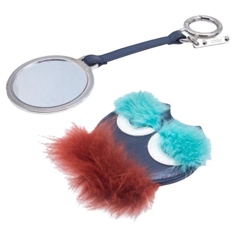 Fendi brings you this pretty bag charm for handbag lovers around the world. The charm consists of a monster bug with eye detailing, fur all over, a mirror, and held by a leather strap with a silver-tone clasp. Adorn your precious bags with this
