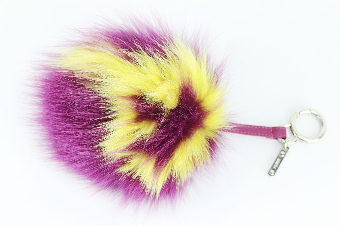 Fendi fox, rabbit fur and leather bag charm. Tonal-pink and white. Lobster clasp fastening at top. Does not come with dustbag or box. Height: 9 in. Width: 5.5 in

