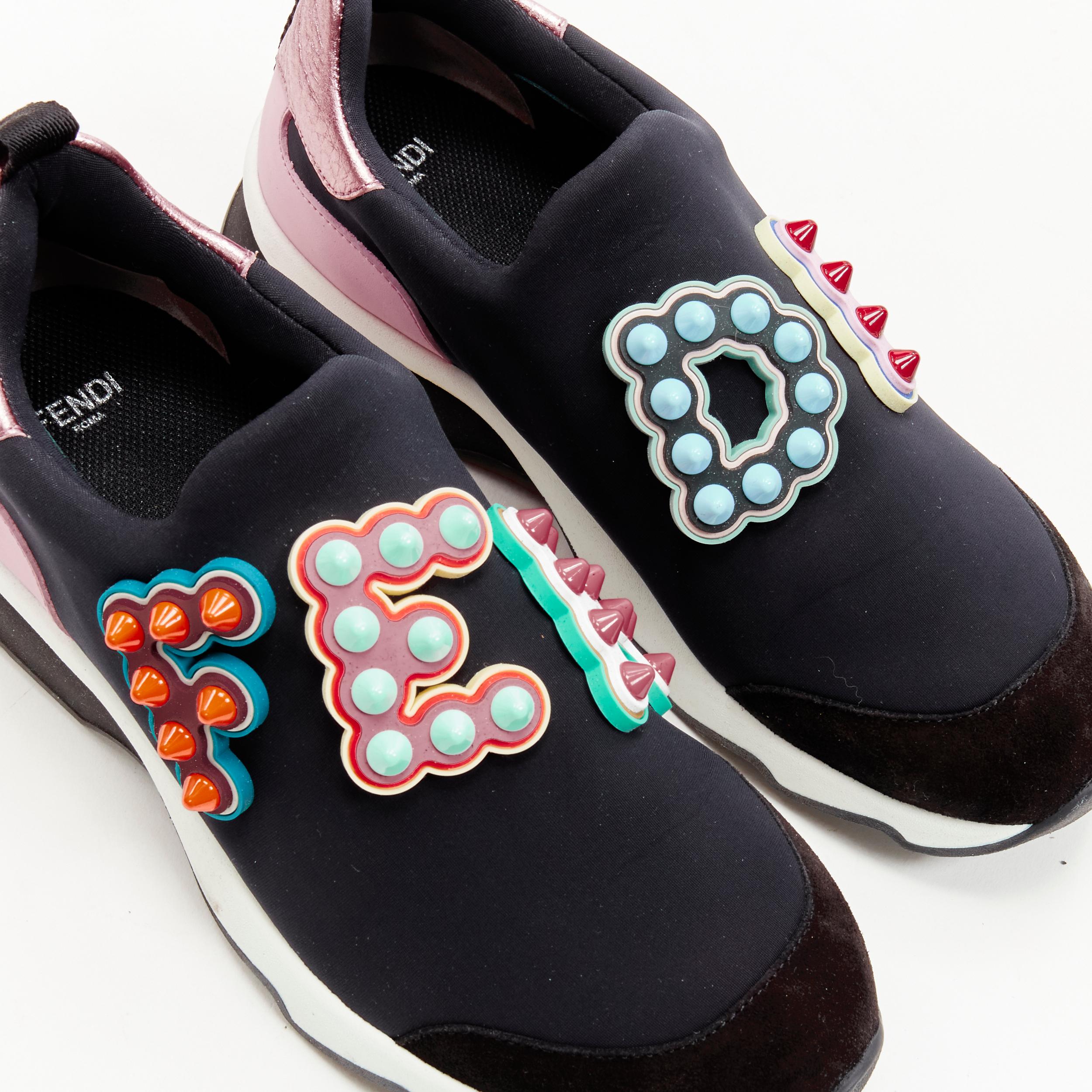 FENDI Fun Fair studded logo rubber applique black pink neoprene low sneaker EU36 
Reference: ANWU/A00358 
Brand: Fendi 
Collection: Fun Fair 
Material: Neoprene 
Color: Black 
Pattern: Solid 
Extra Detail: Neoprene upper with metallic leather trim