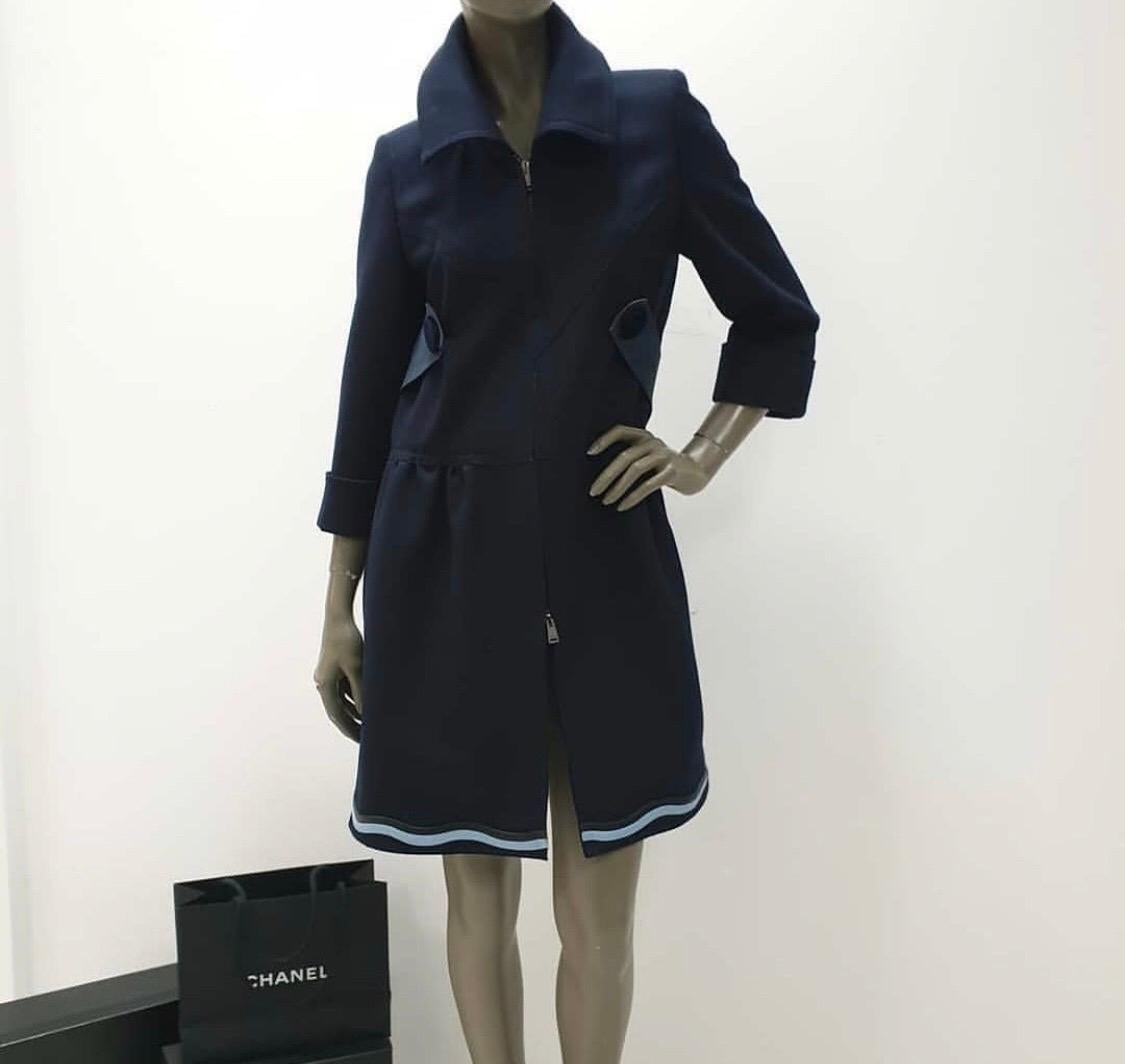 Fendi Felt Coat in Blue. 
size 40
Self: 87% wool 10% cashmere 3% elastanContrast Fabric: 100% silkContrast Fabric 2: 100% lambskin leatherCollar: 100% real dyed shadow fox fur.
Made in Italy.
Fur Origin: Finland.
Professional fur cleaning only.
Dual