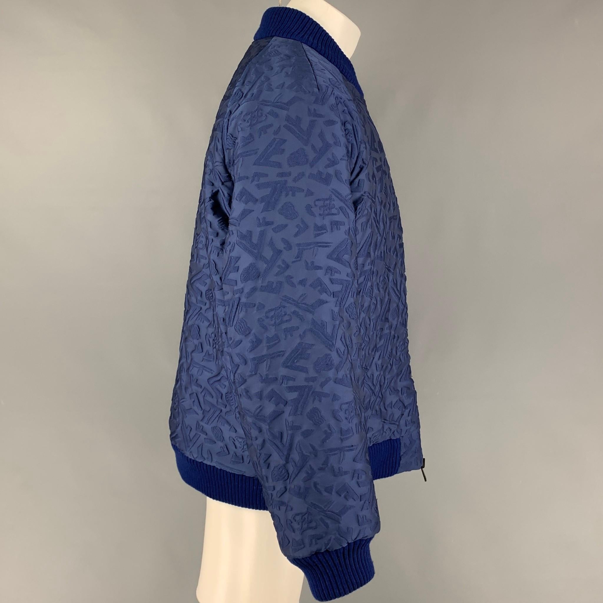 FENDI FW Capsule 2022 jacket comes in a blue 3D fragment wool featuring a reversible style, oversized fit, bomber, ribbed hem, slit pockets, and a full zip up closure. Matching shorts sold separately. Made in Italy. 

New With Tags. 
Marked: