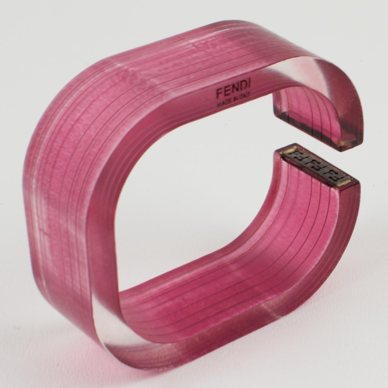 Lovely Fendi, Italy bracelet bangle. Geometric resin or acrylic bracelet, featuring a square cuff in translucent pink-red raspberry color, ornate with sterling silver 