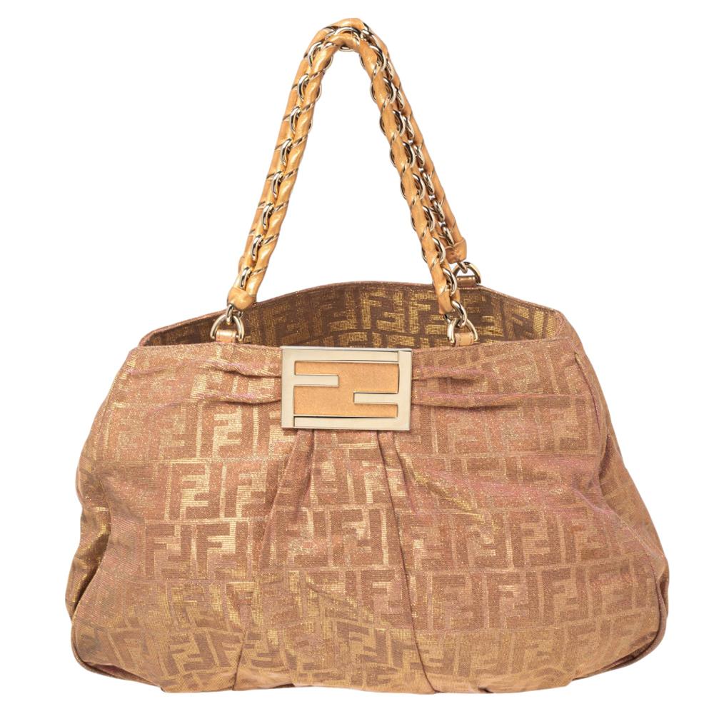 Complete a winning look with this Mia shoulder bag from Fendi. Crafted from Zucca shimmer canvas, the front comes with a striking gold-tone F that reveals a spacious interior sure to fit in your everyday essentials. The handles further add an edge