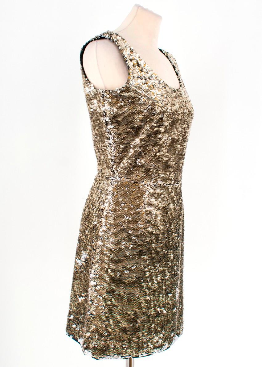 Fendi Sequin Mini Dress

- Mini dress
- Gold and White sequins 
- Crew neckline 
- Hidden back zipper 
- Sleeveless 

Please note, these items are pre-owned and may show some signs of storage, even when unworn and unused. This is reflected within