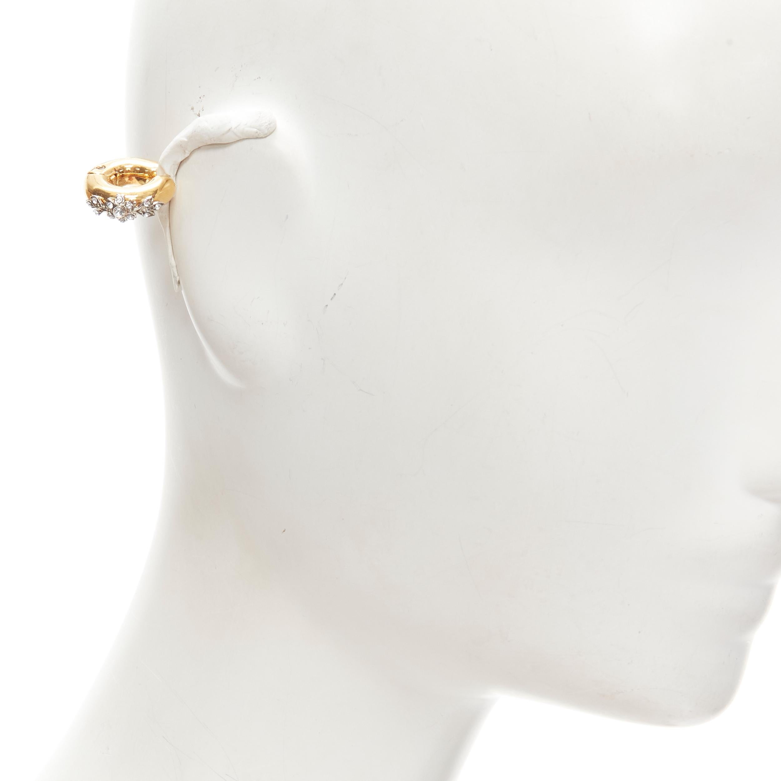 FENDI gold tone crystal embellished clip on earring ear cuff
Brand: Fendi
Material: Metal
Color: Gold
Pattern: Solid
Made in: Italy

CONDITION:
Condition: Excellent, this item was pre-owned and is in excellent condition. 
Comes with: One dust bag.